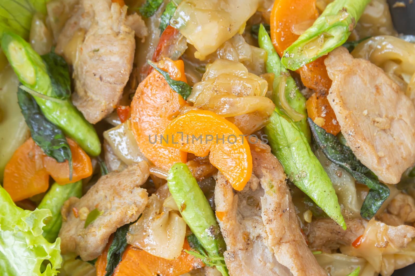 Stir Fried Noodle and Pork and Carrot and Yardlong Beans and Lettuce with Black Soy Sauce on Flatlay View with Natural Light in Close Up View