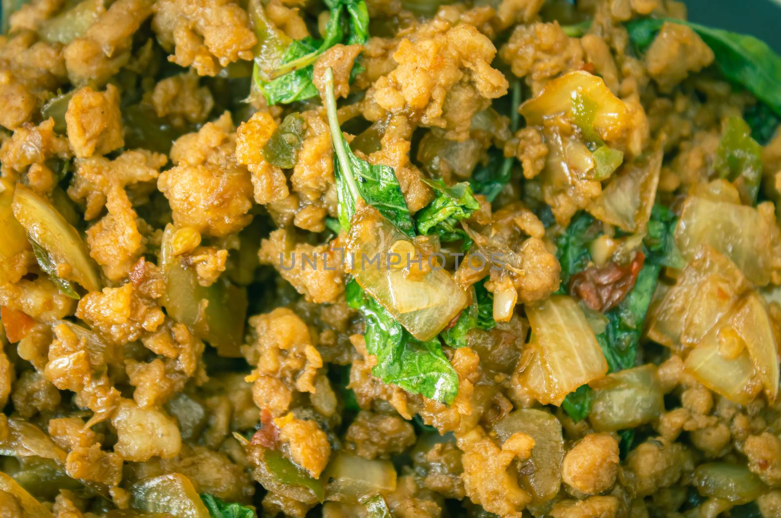 Stir-Fried Pork and Holy Basil and Chili in Close Up View. Delicious Thailand Food Menu for Health in Vintage Tone