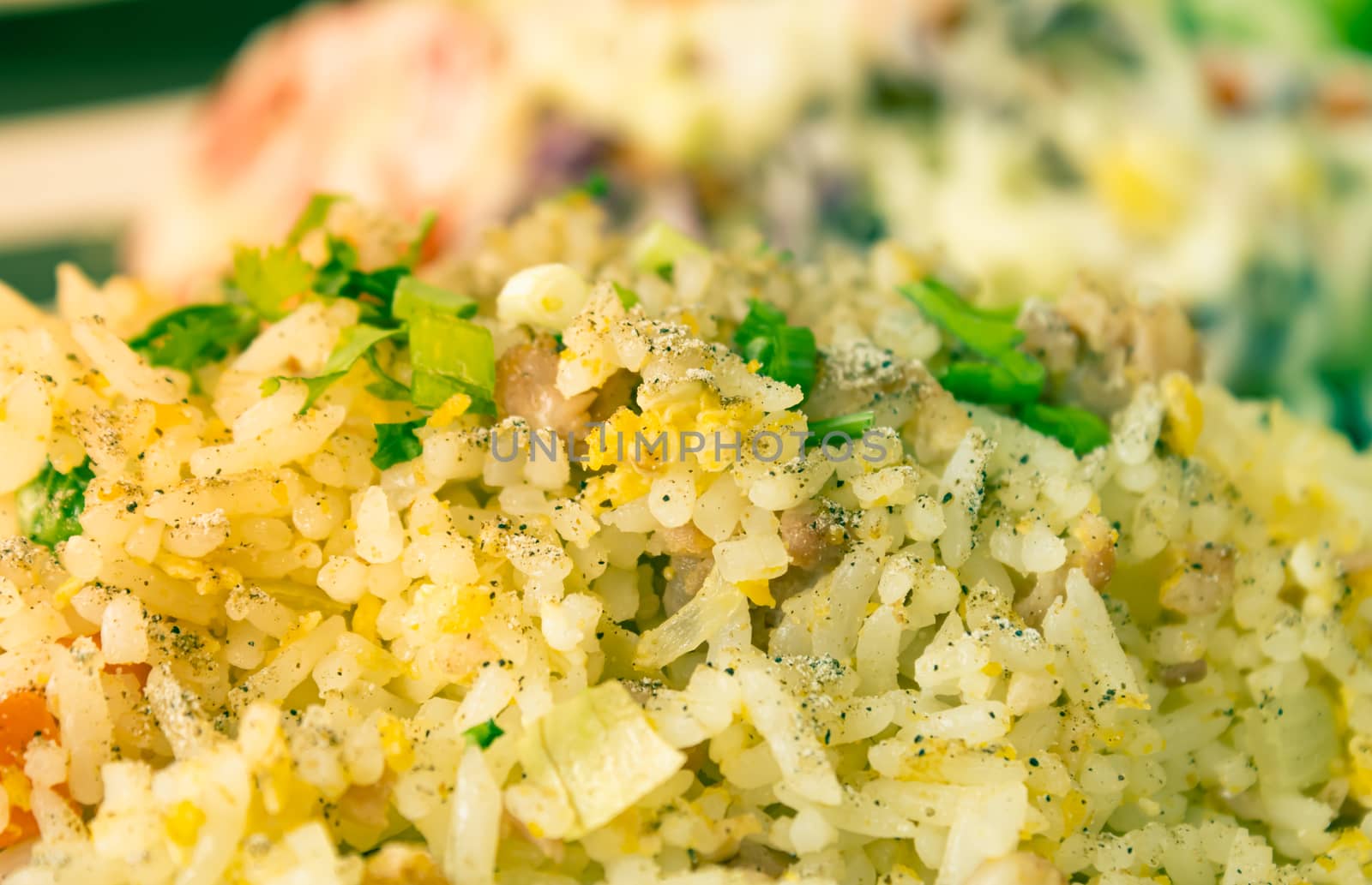 Thai Sour Pork Fried Rice and Salad in Dish with Natural Light in Close Up View in Vintage Tone