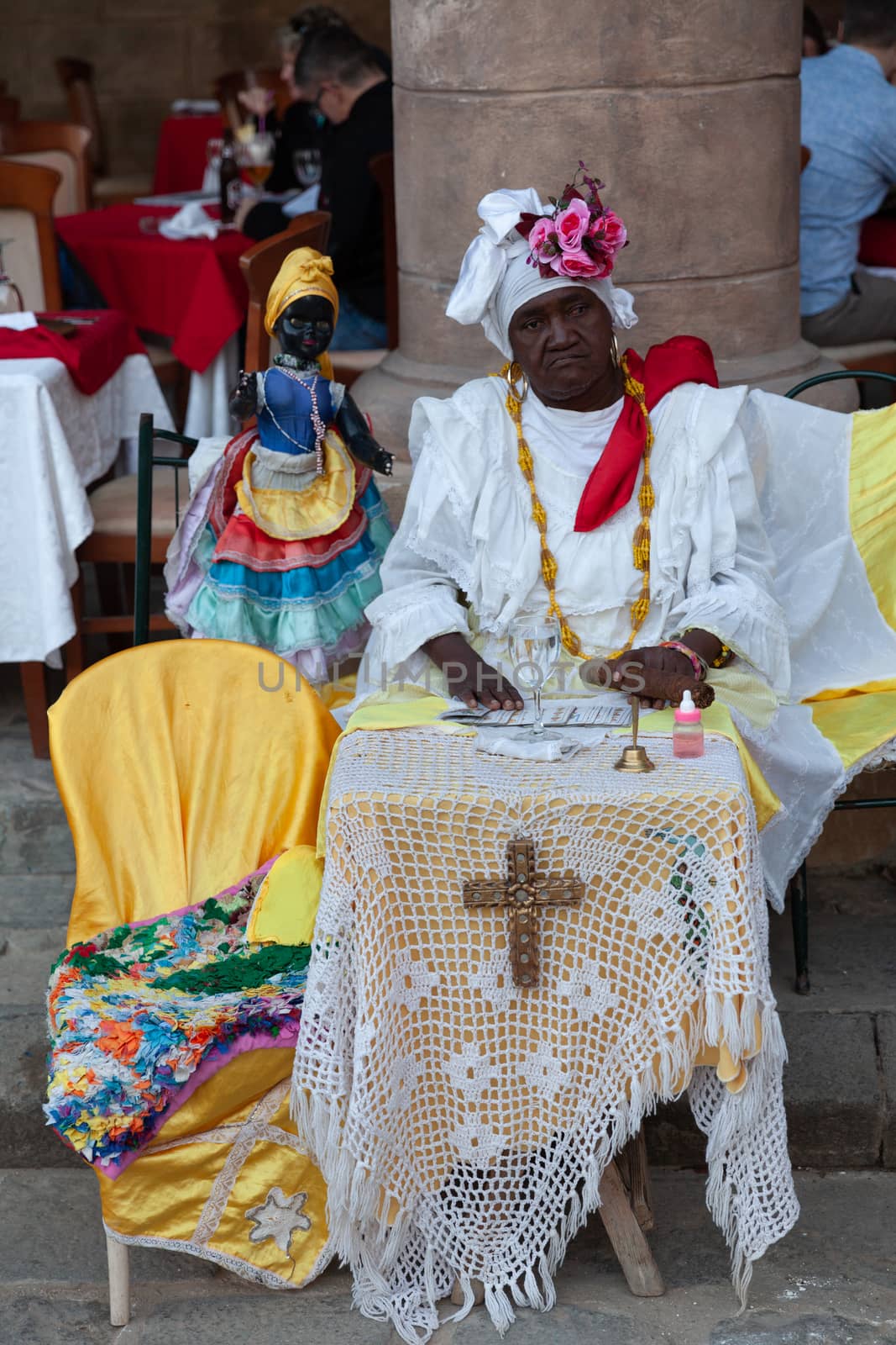 Cuban santeria practitioners on Plaza de la Catedral, Havana, Cuba by vlad-m