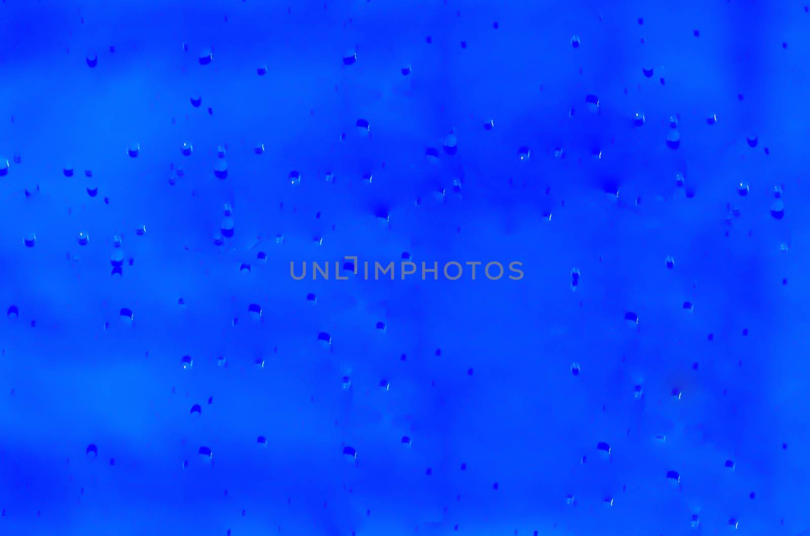 Closeup of a blue liquid, water, background image.