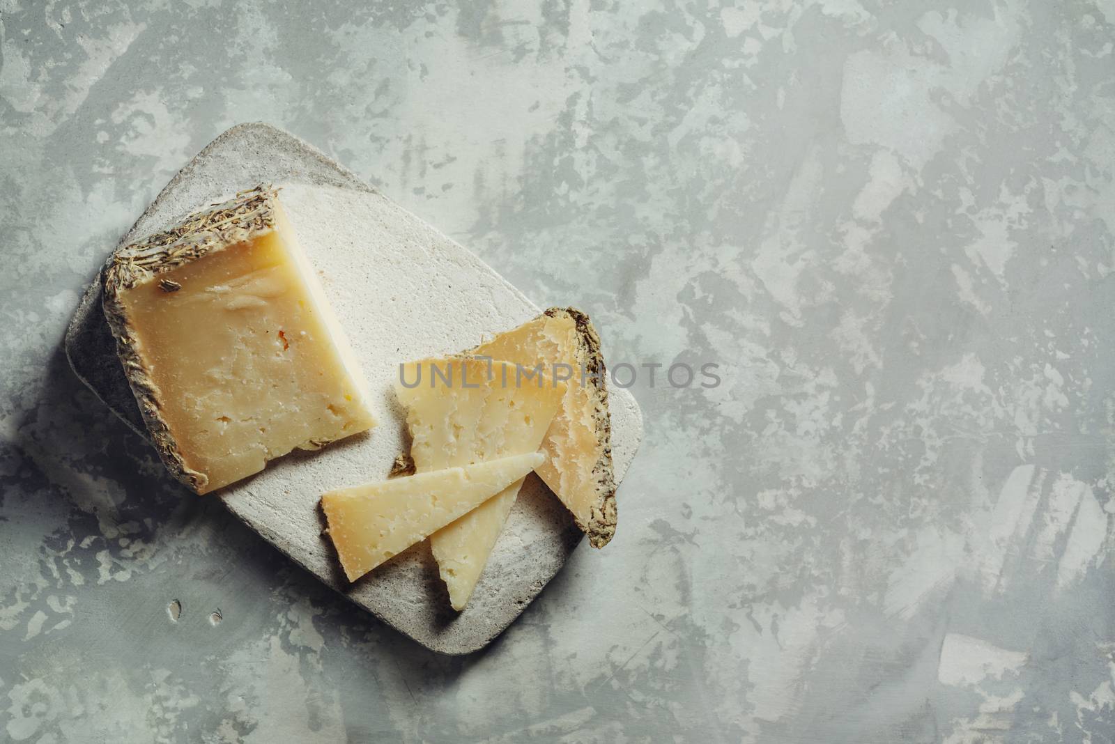 Semi-cured cheese "Villarejo Rosemary", made with raw sheep's milk and cured in Iberian lard and Romero. gold medals at the World Cheese Awards and the prize for the best cheese in the world at the Rome contest