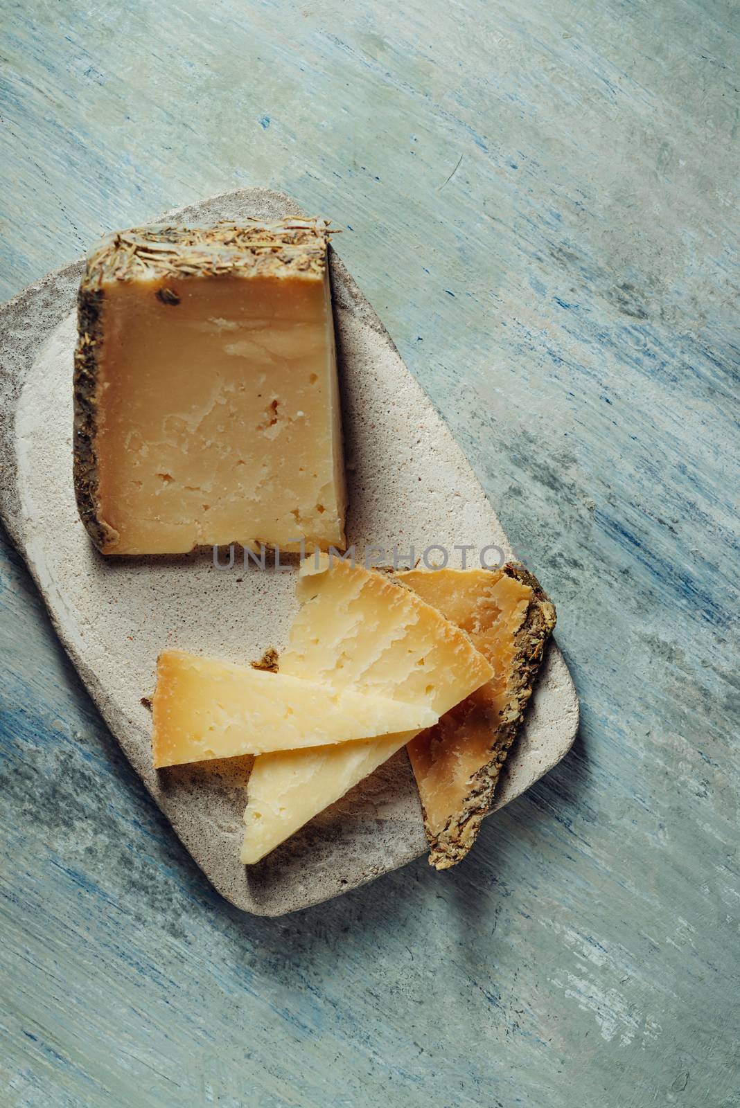 Semi-cured cheese "Villarejo Rosemary", made with raw sheep's milk and cured in Iberian lard and Romero. gold medals at the World Cheese Awards and the prize for the best cheese in the world at the Rome contest