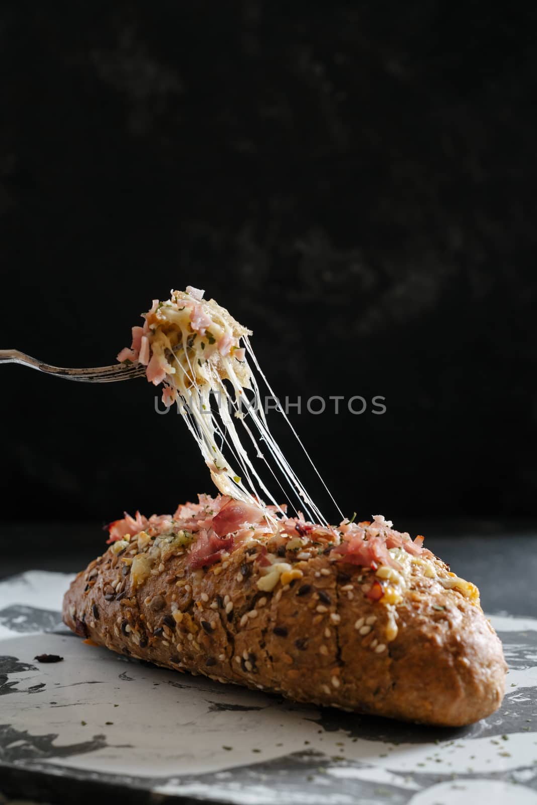 Fresh baked cheesy pull apart bread, with garlic, olive oil and herbs butter