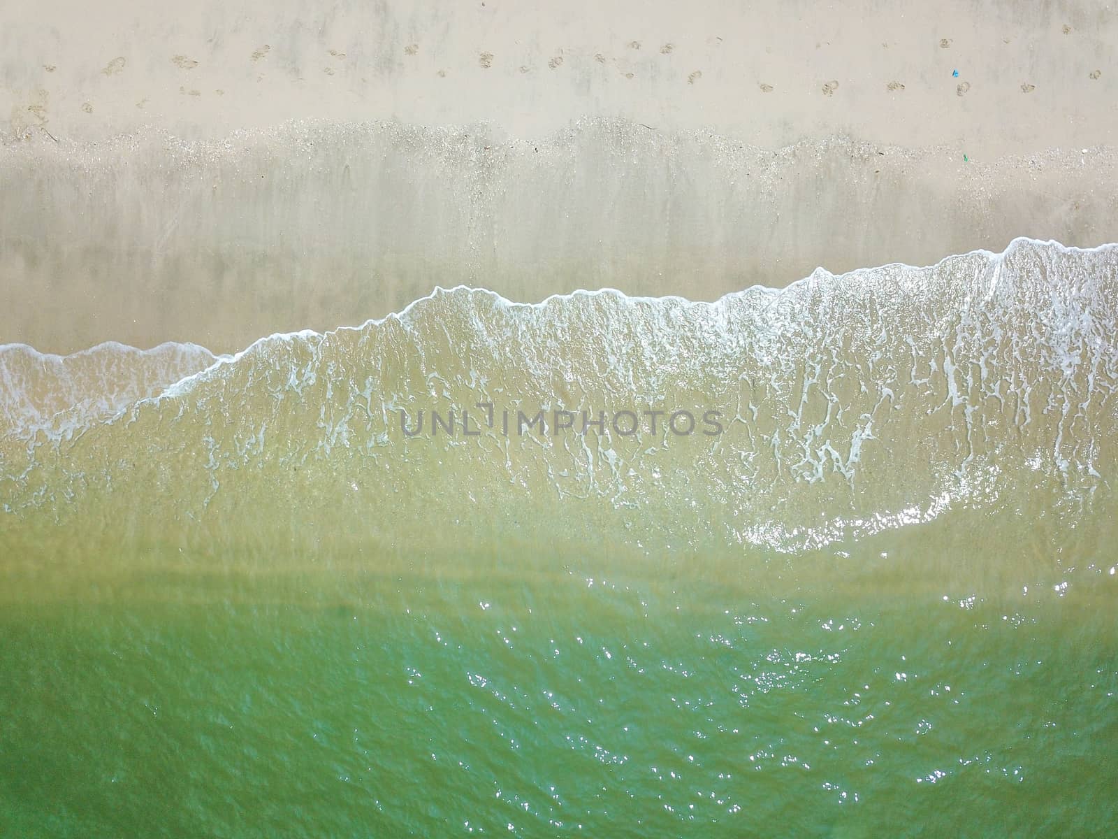 Blue ocean wave on clean sandy beach by silverwings