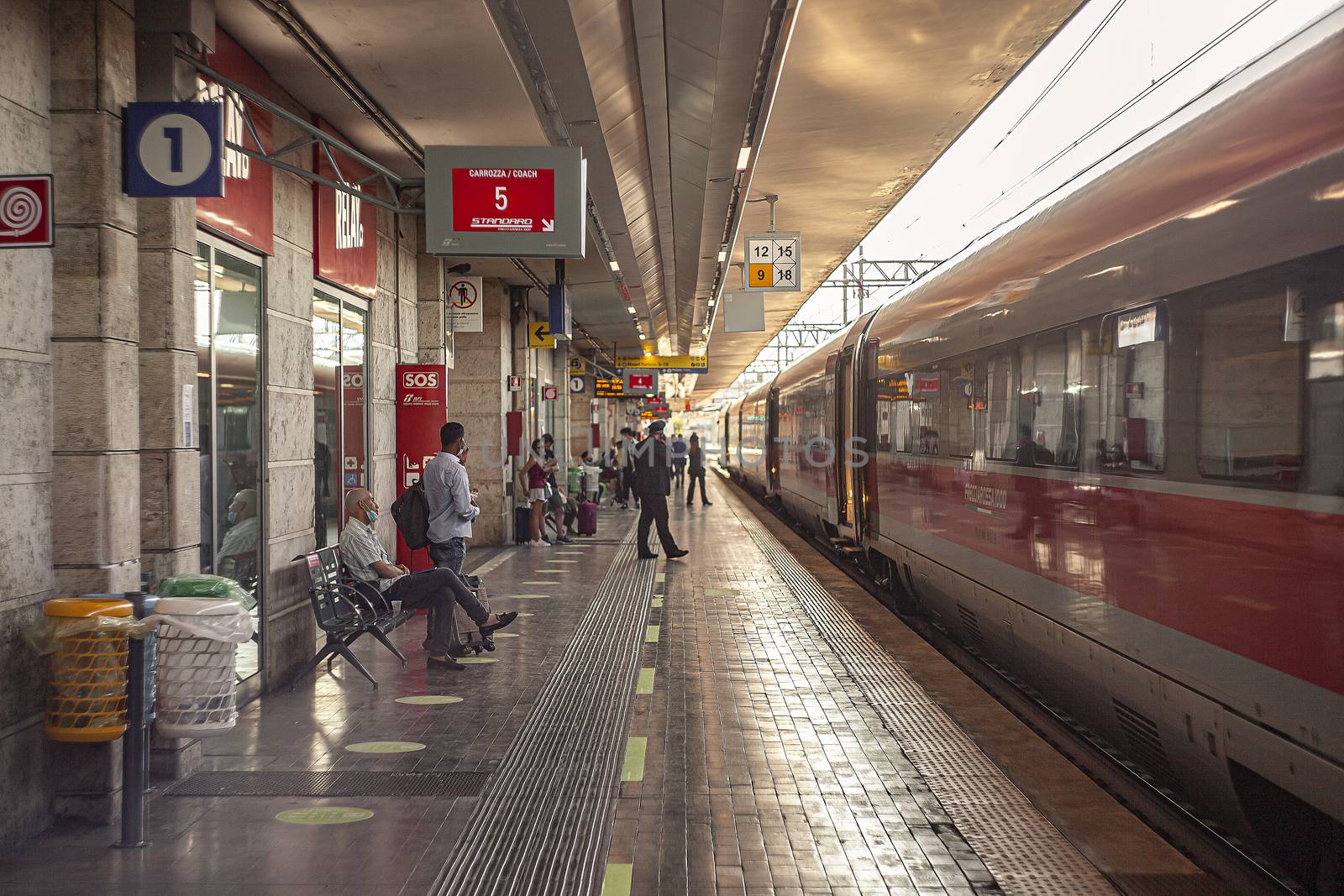 PADOVA, ITALY 17 JULY 2020: Padua railway station with train and people