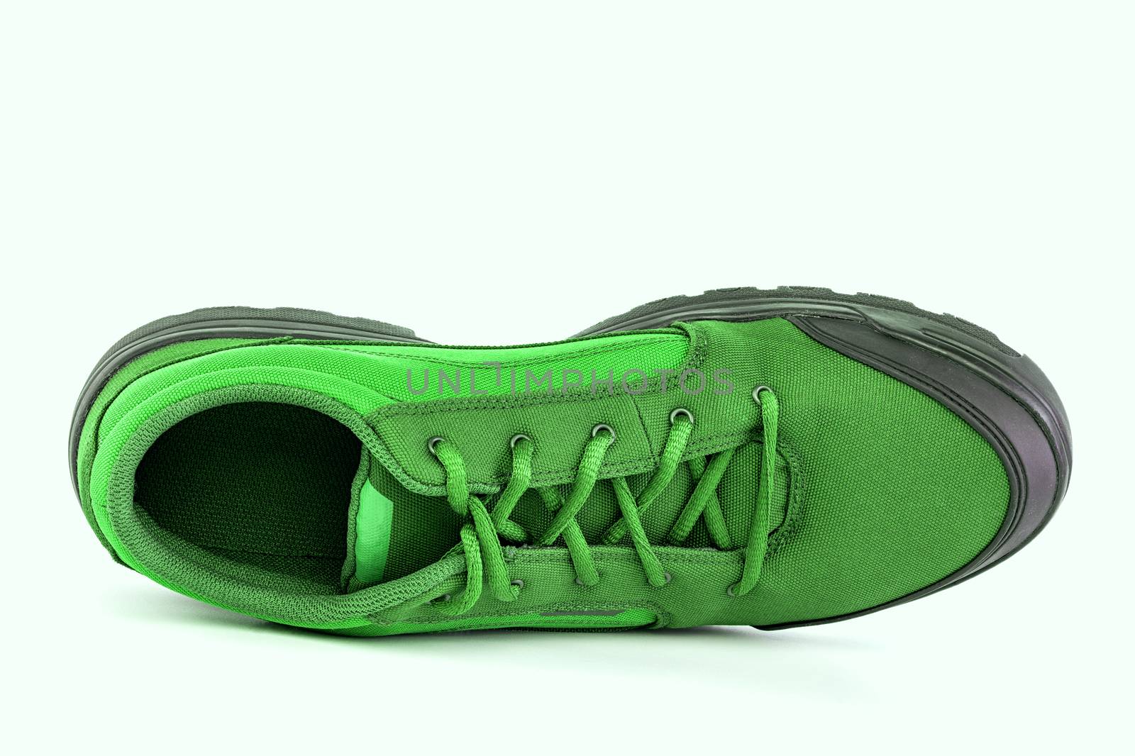 right cheap green hiking or hunting shoe isolated on white background.