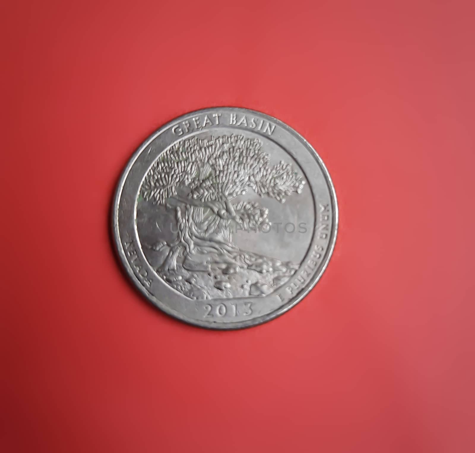 Quarter coin with back side placed in red background