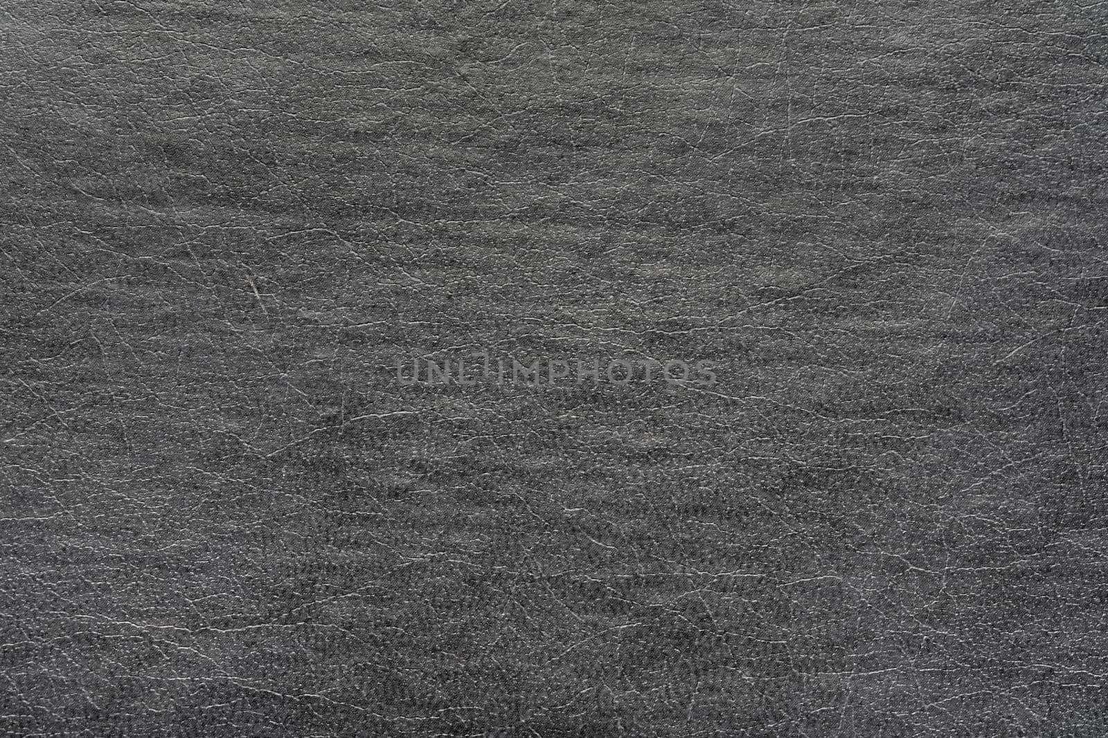 Synthetic dark gray, black leather for background. Close-up decoration material by Alexander-Piragis
