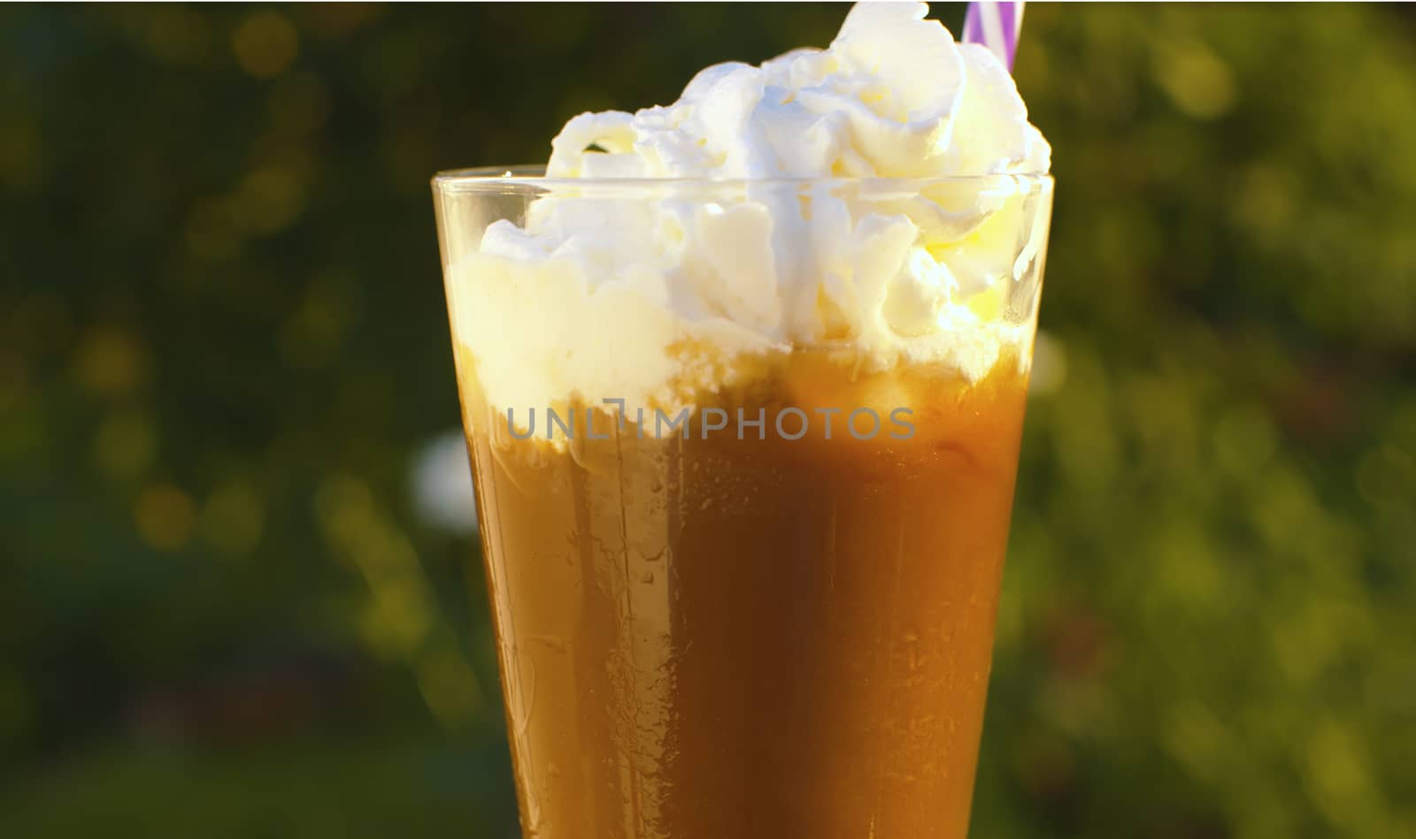 Iced coffee with whipped cream by Alize