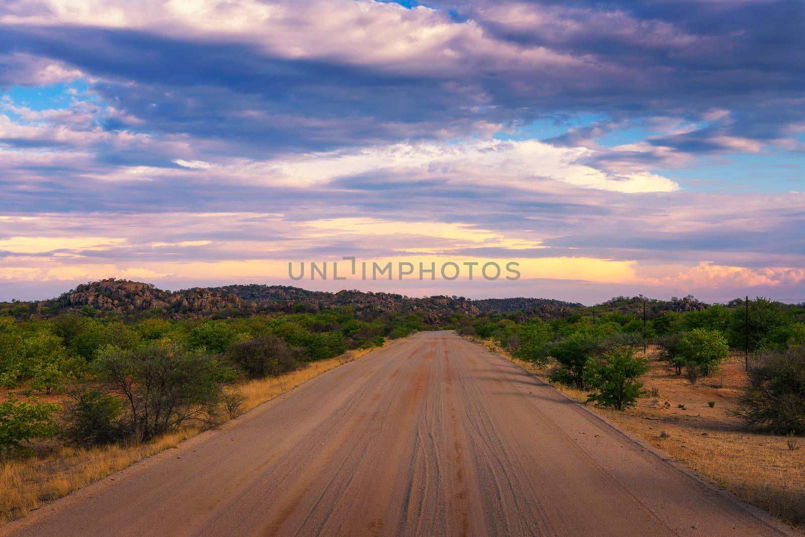 Sunset over the gravel road C35 in Damaraland, Namibia by nickfox