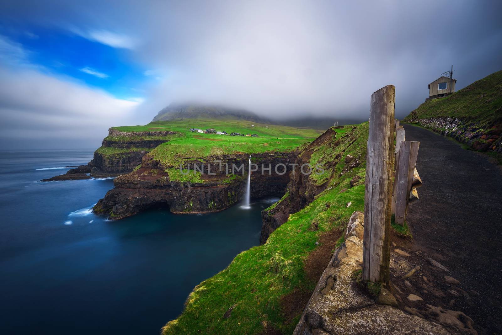 Gasadalur village and Mulafossur waterfall on Faroe Islands, Denmark by nickfox