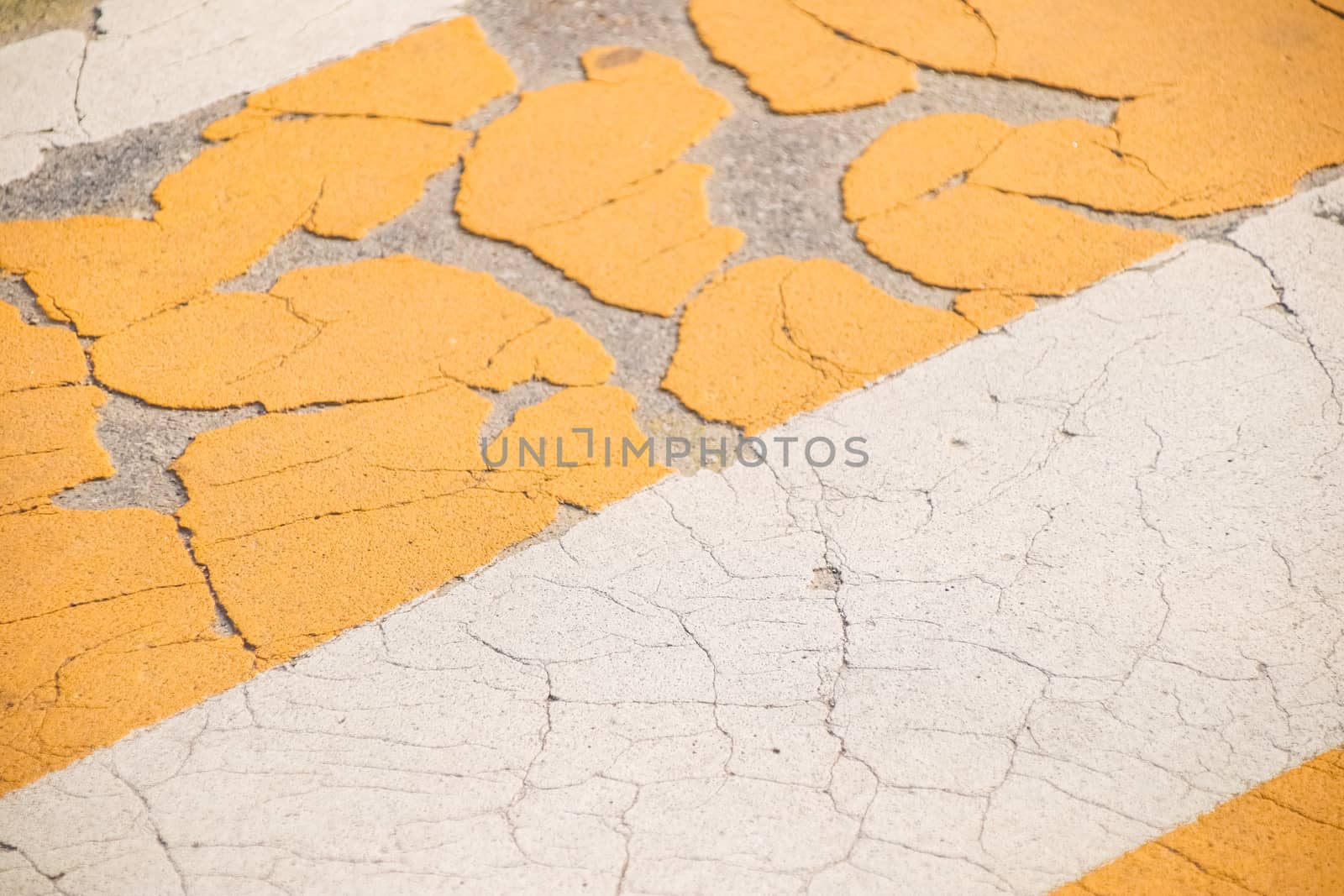 Grunge Road Markings For Pedestrians With Yellow And White Paints texture.