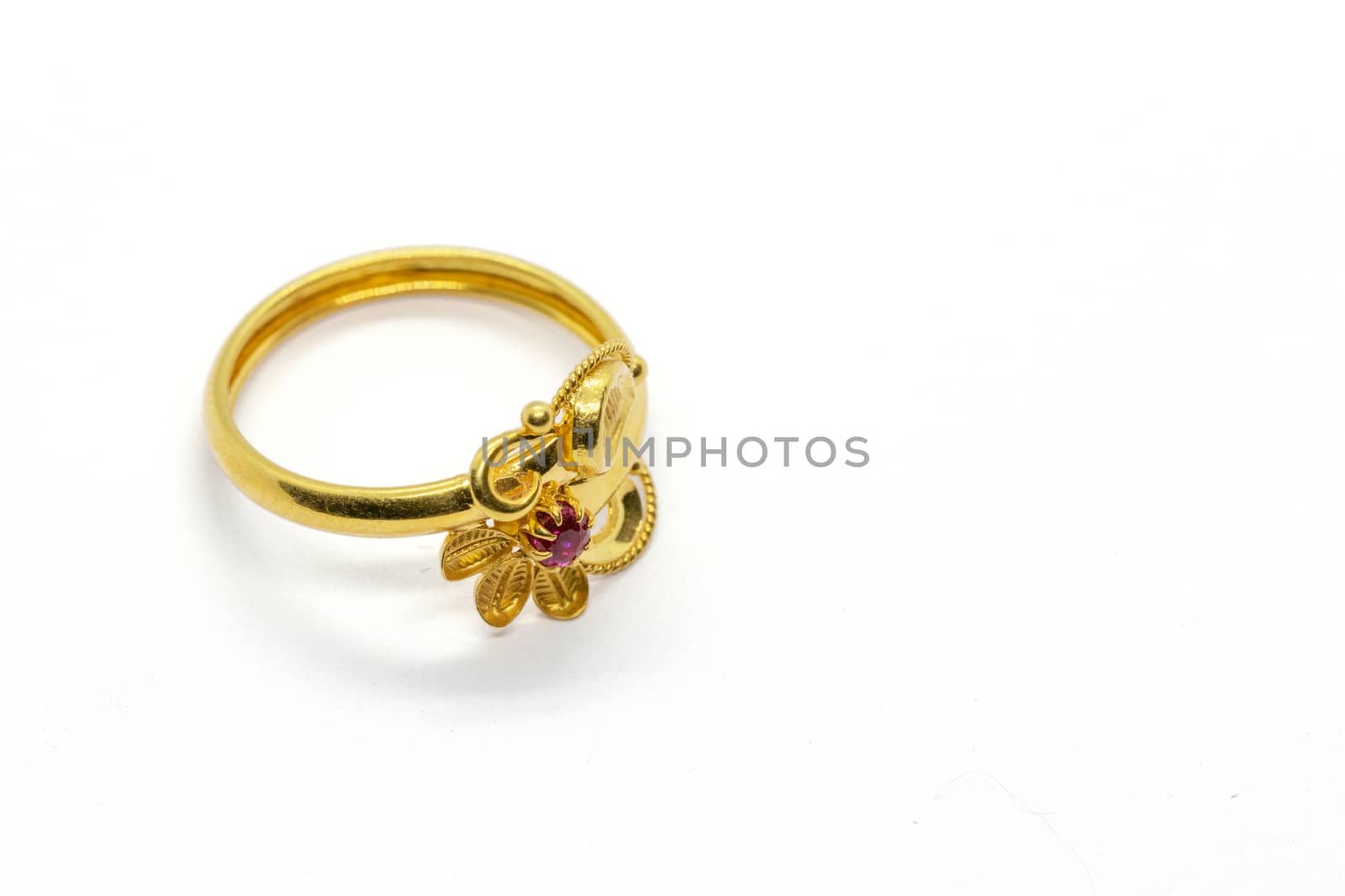one red stone gold lady ring design for anniversary on the white background