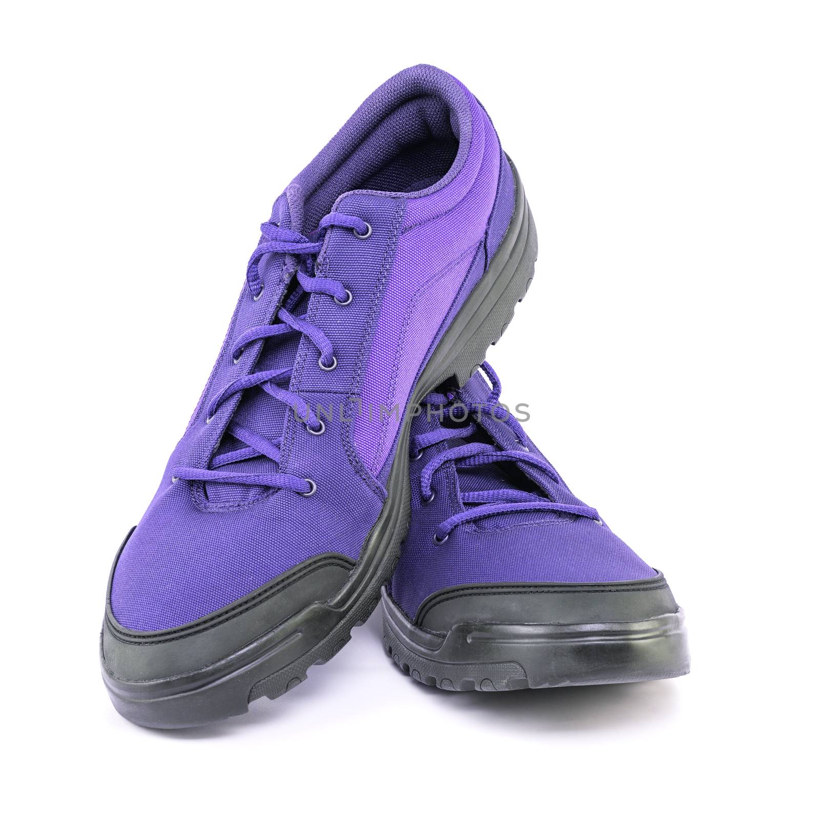 a pair of cheap cheap purple hiking shoes isolated on white background - perspective close-up view.