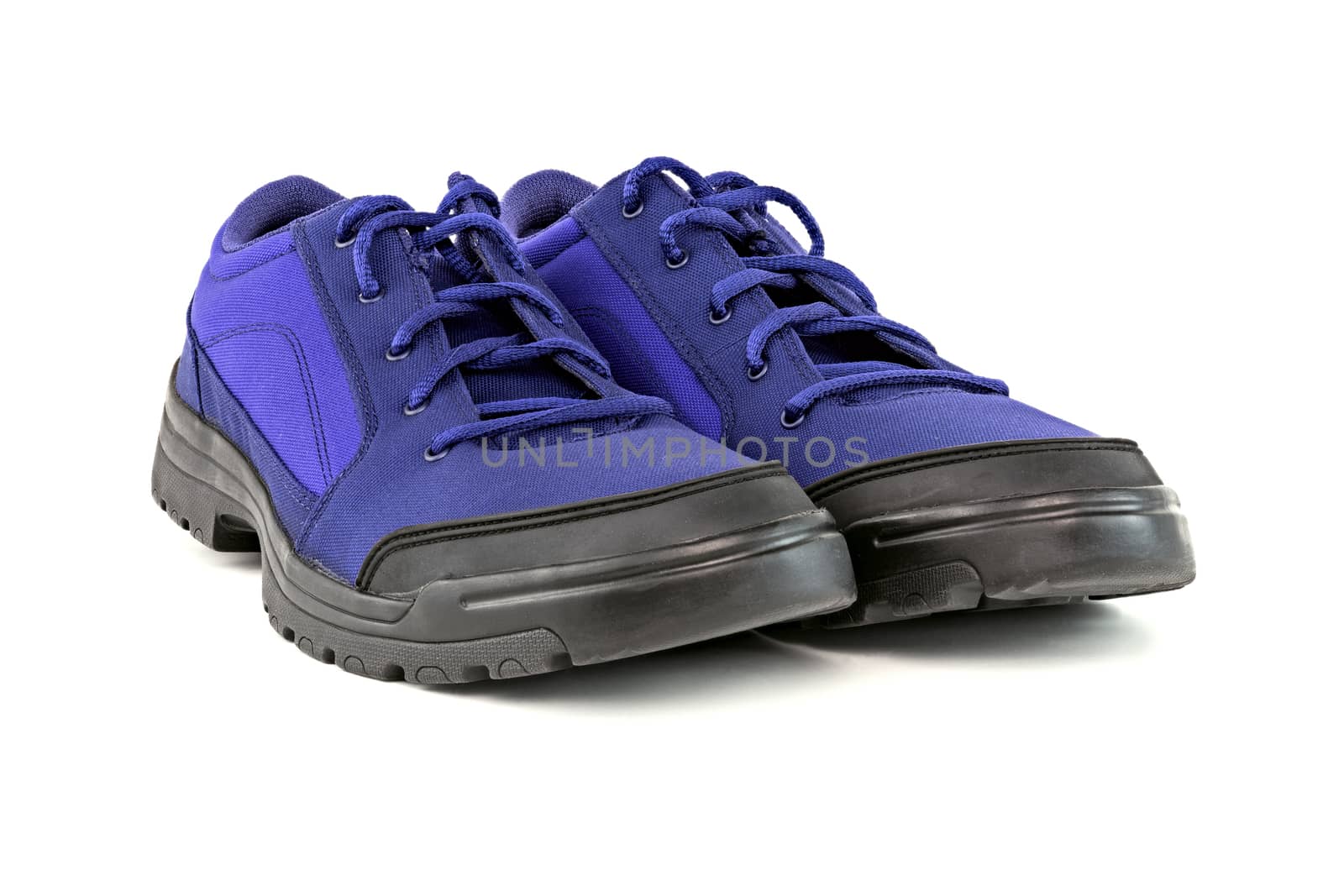 a pair of blue cheap durable fabric travel shoes isolated on white background.