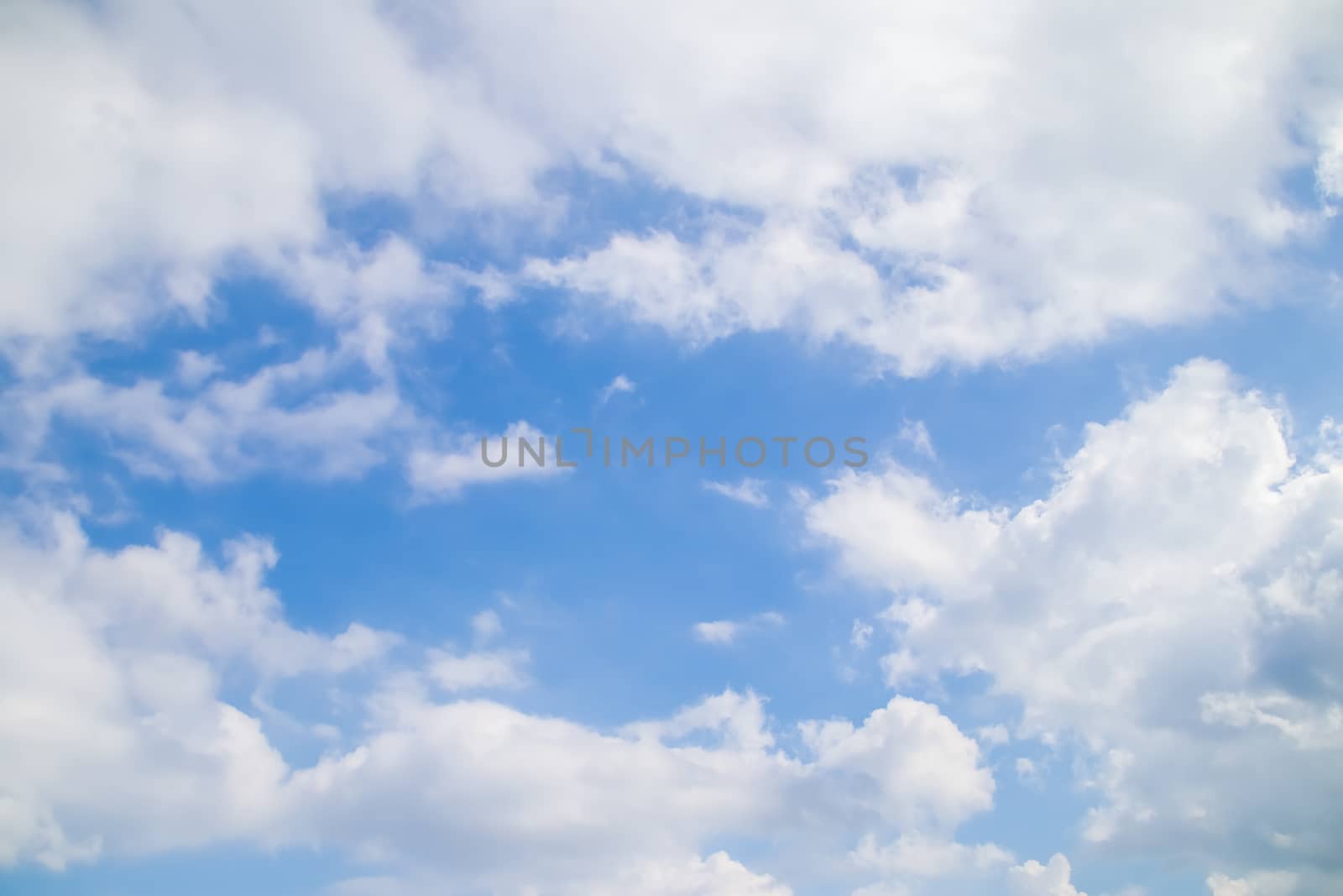 Blue sky background with tiny clouds.Cloudy blue sky abstract background. by anotestocker