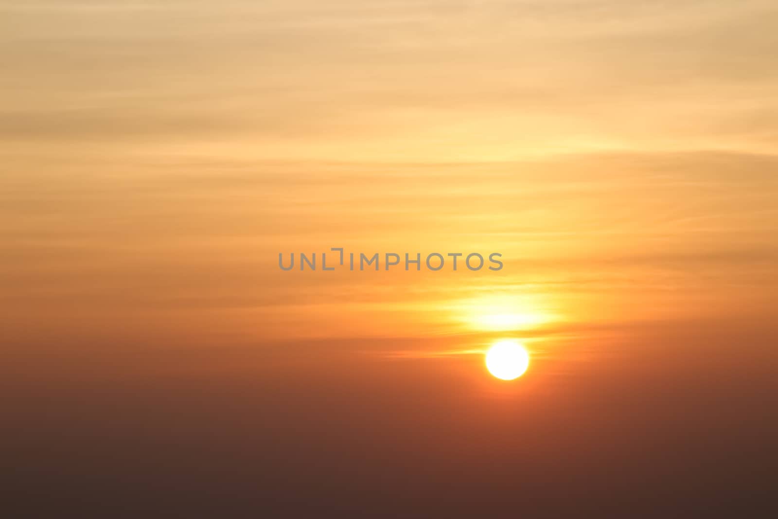 Beautiful sunset or sunrise sky above clouds with dramatic light. by anotestocker