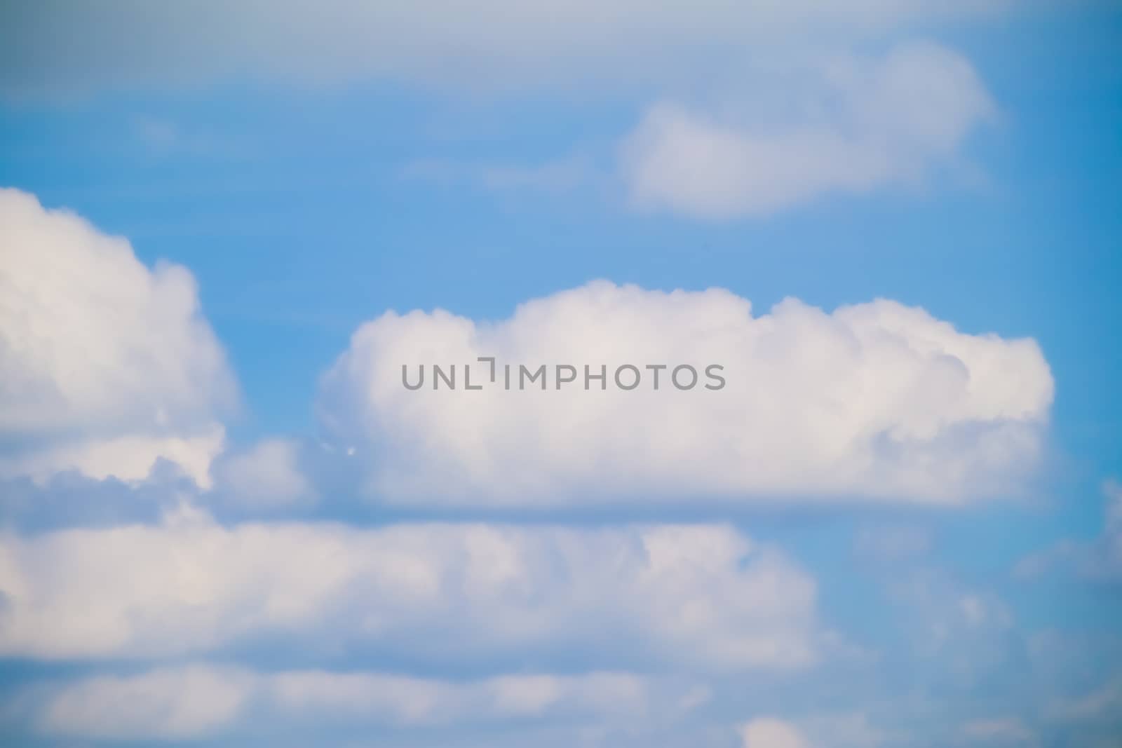 Blue sky background with tiny clouds.Cloudy blue sky abstract background. by anotestocker