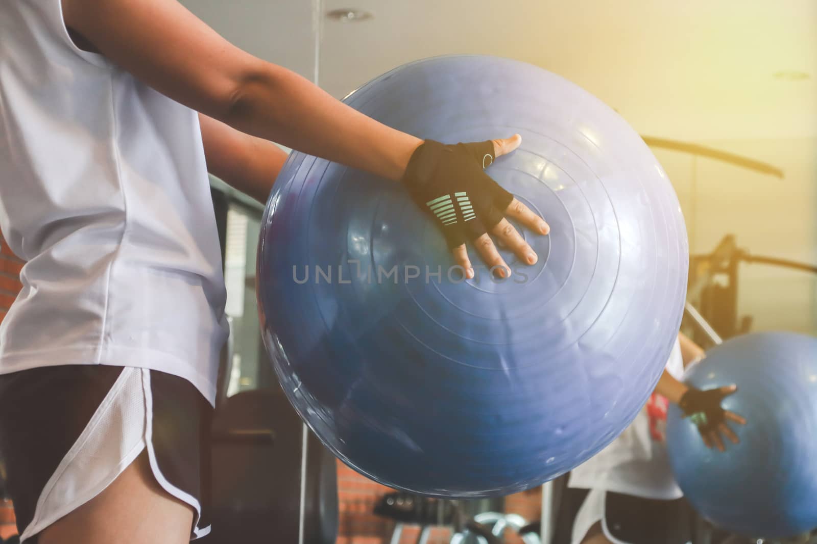 woman working out with gymnastic ball.