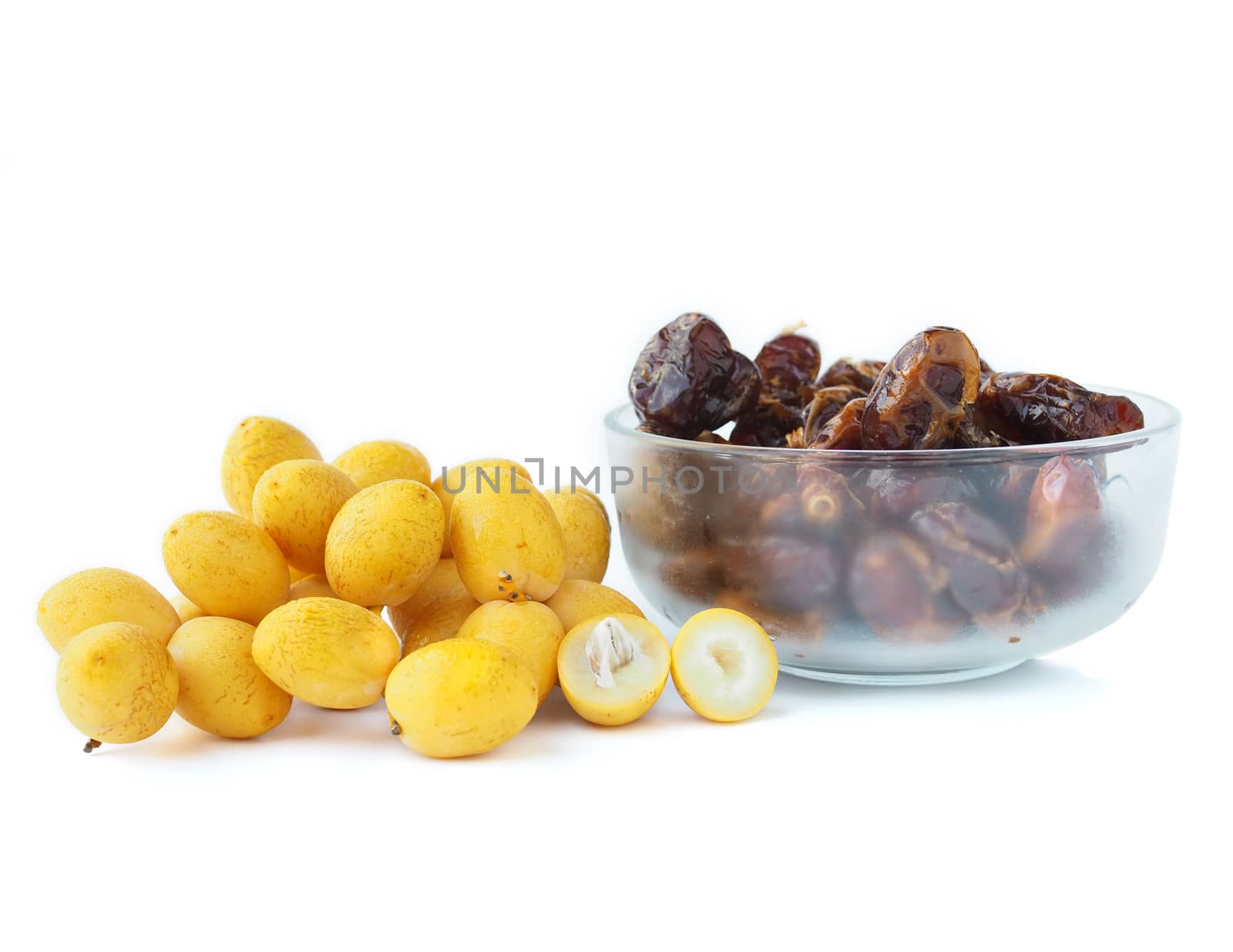 Close-up of fresh and dried date plam isolated on a white backgr by Unimages2527
