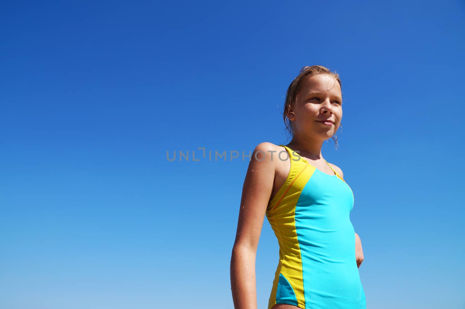 girl in a swimsuit against a clear blue sky by Annado