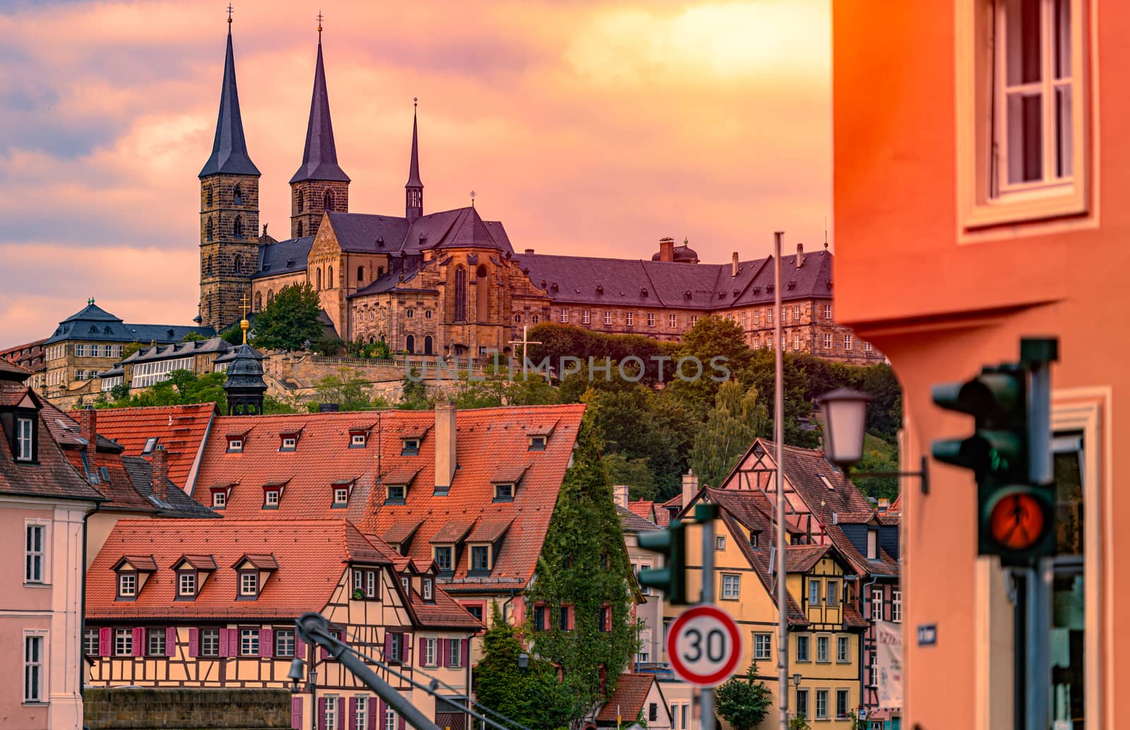 Bamberg city in Germany. Cathedral and sunset cloudy sky in background. Architecture and travel in Europe