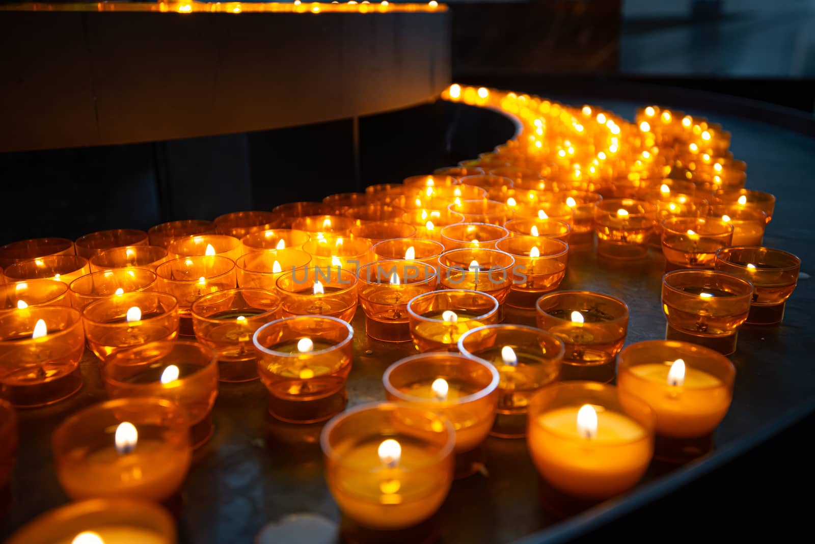 Candles in church of Wurzburg, Bavaria, Germany. Religion and christianity attributes