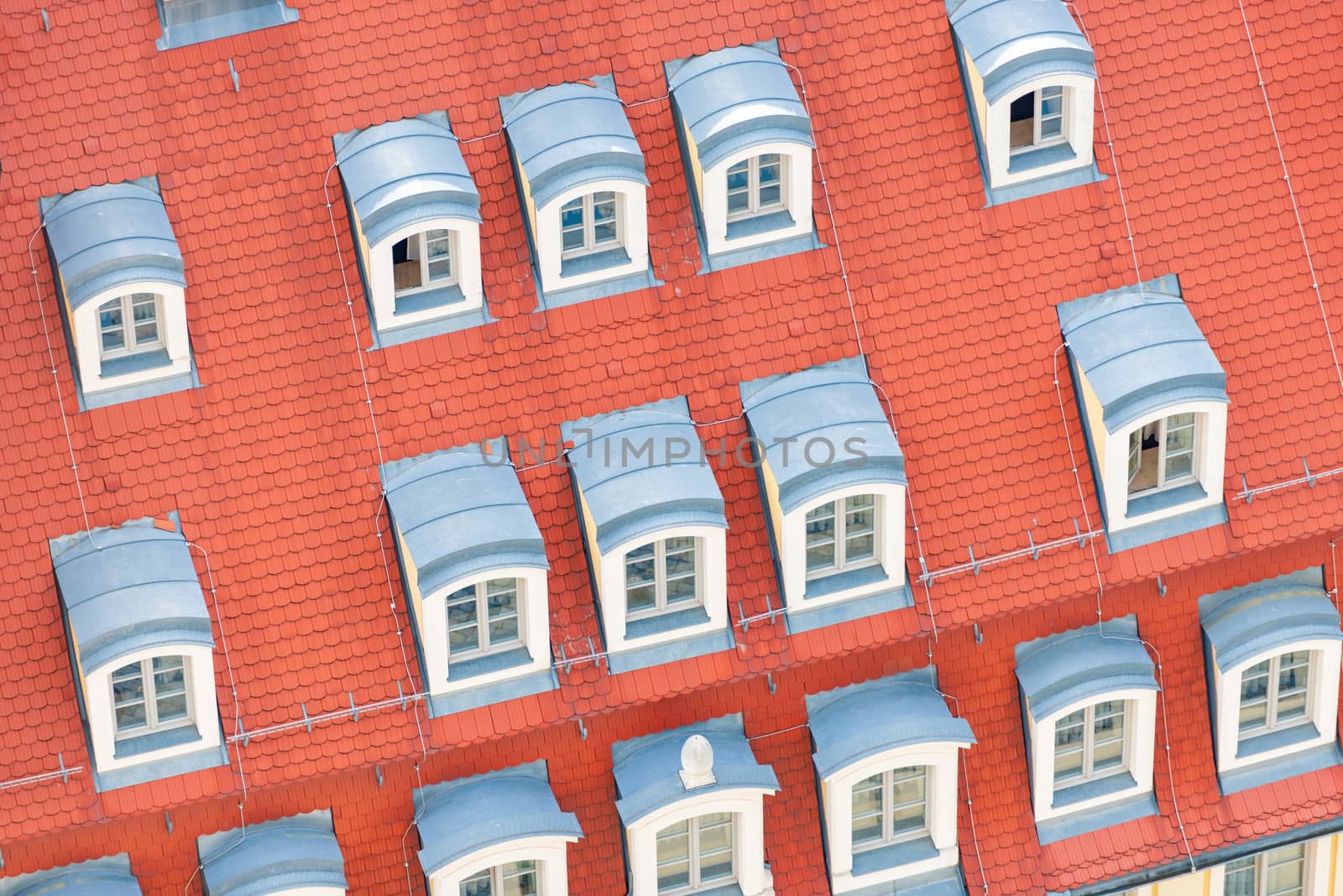 Tiled house roof with window in Wroclaw, Poland. Old town architecture of Europe.