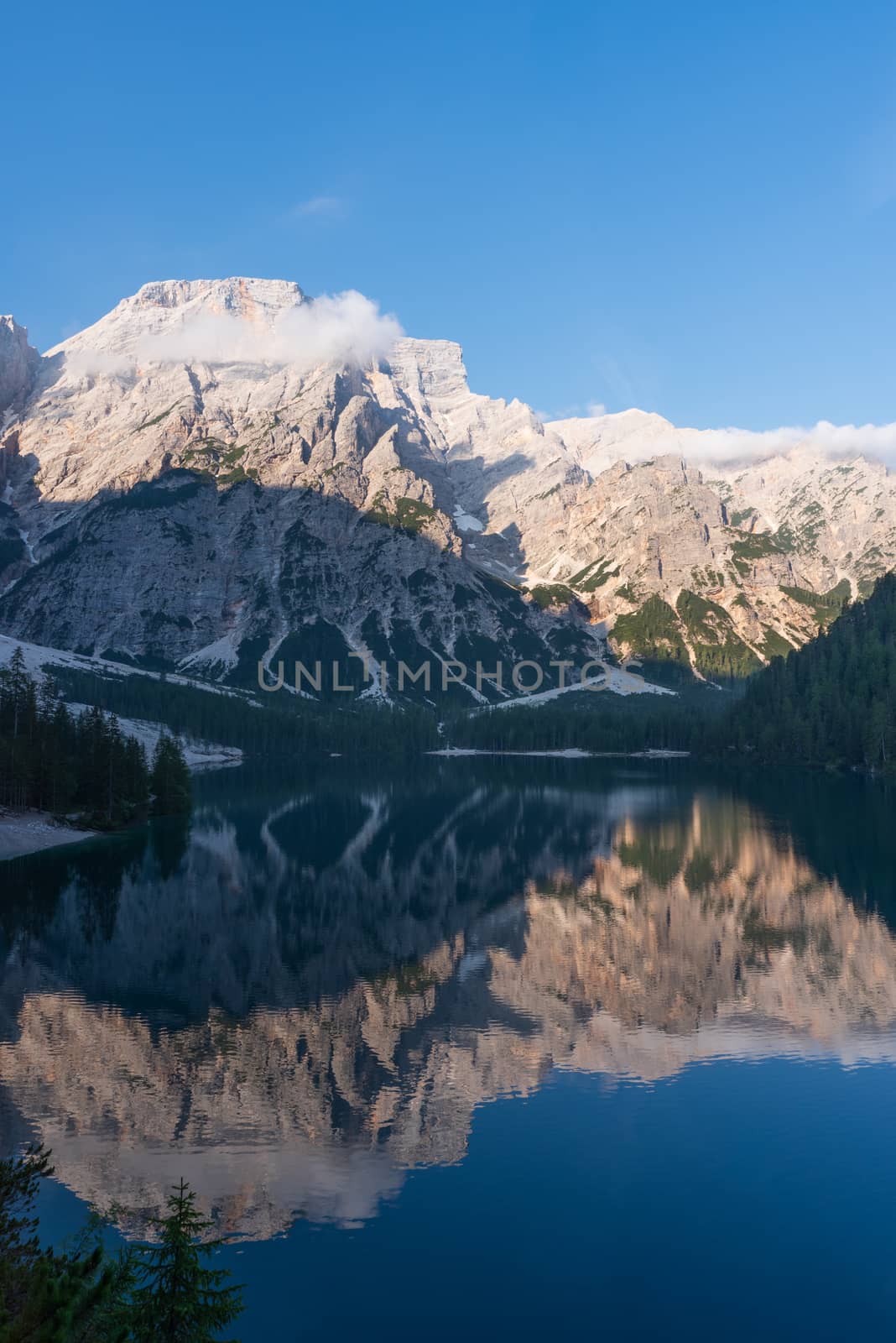 Mountain landscape reflected in the waters of Lake Braies, Italian Dolomites in South Tyrol