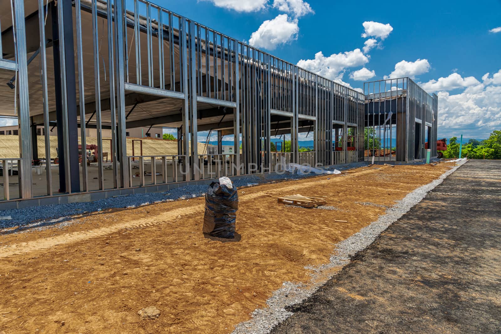 Horizontal shot of the framework for a new commercial building being constructed.

