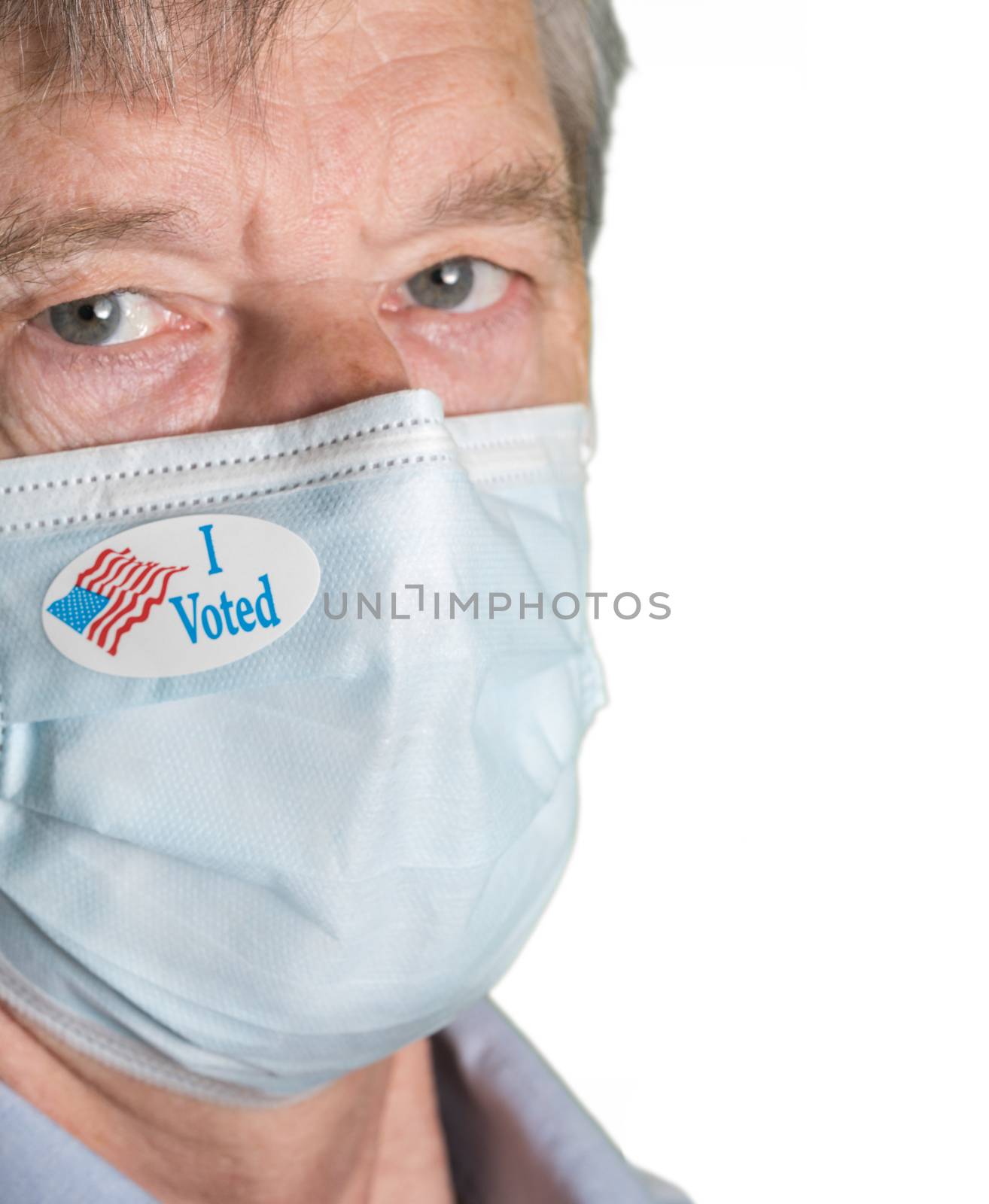 I Voted paper sticker on mans face mask against white background by steheap