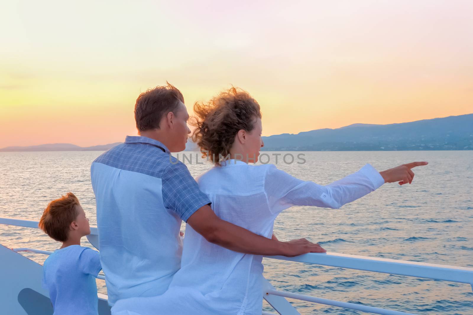 Family with one child. High season vacation. Christmas vacation concept. Positive emotions. Happy family traveling on sea transport. Love and support in family. Warm relationships by synel