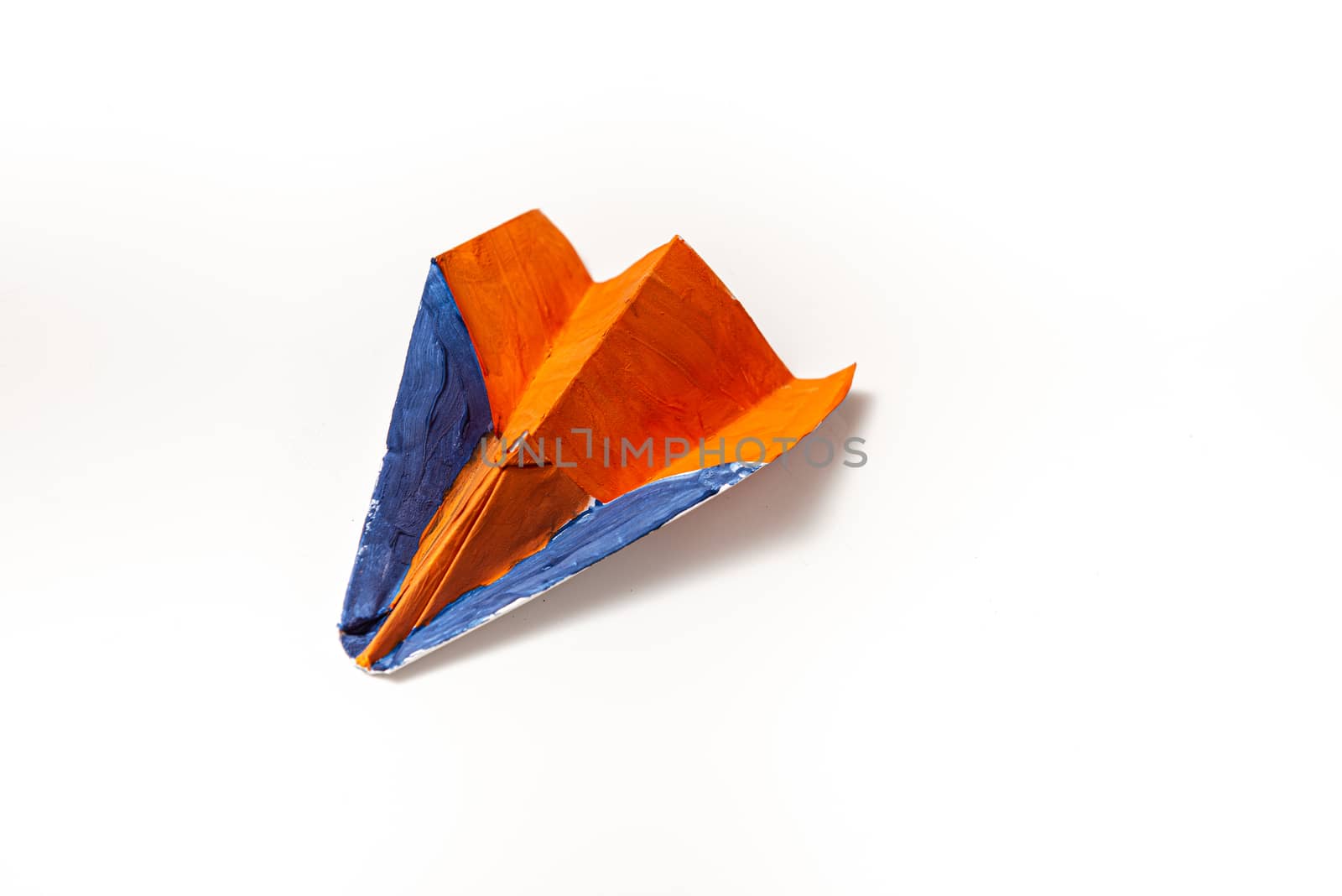 Color paper plane on a white background with copy space by marynkin