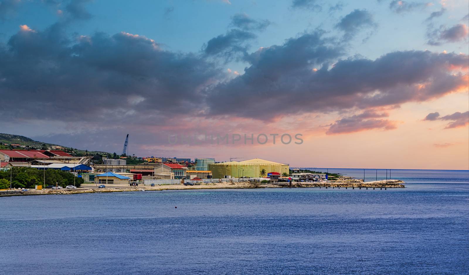Heavy Industry on Coast of Curacao by Blue Water