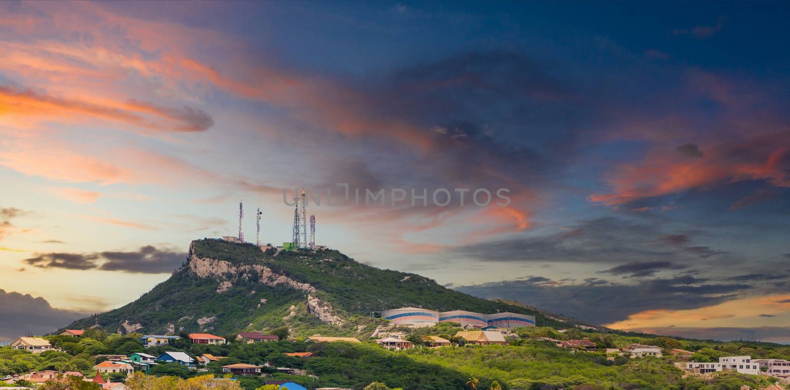 Mountain with Industry in Curacao at Dusk by dbvirago