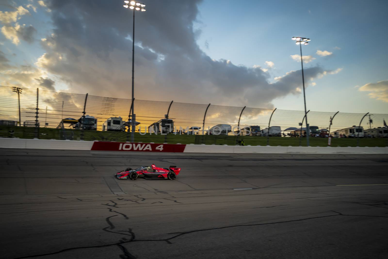 ALEX PALOU (R) (55) of Barcelona, Spain races through the turns during the race for the Iowa INDYCAR 250s at Iowa Speedway in Newton, Iowa.