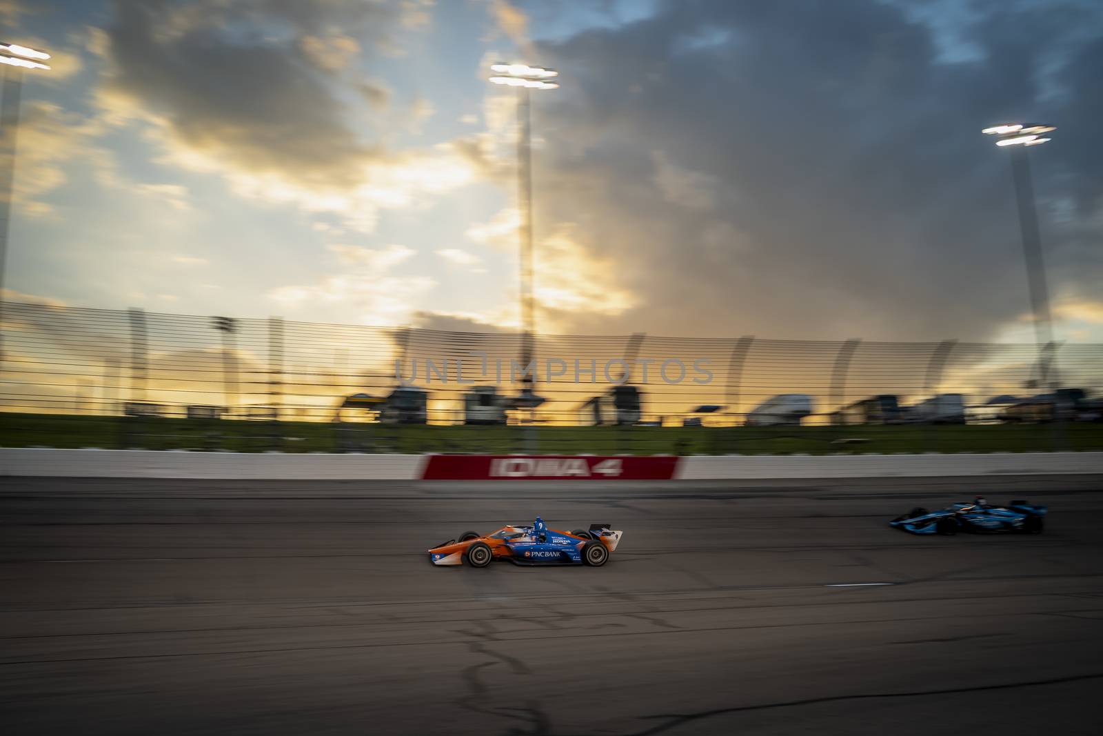 SCOTT DIXON (9) of Auckland, New Zealand races through the turns during the race for the Iowa INDYCAR 250s at Iowa Speedway in Newton, Iowa.