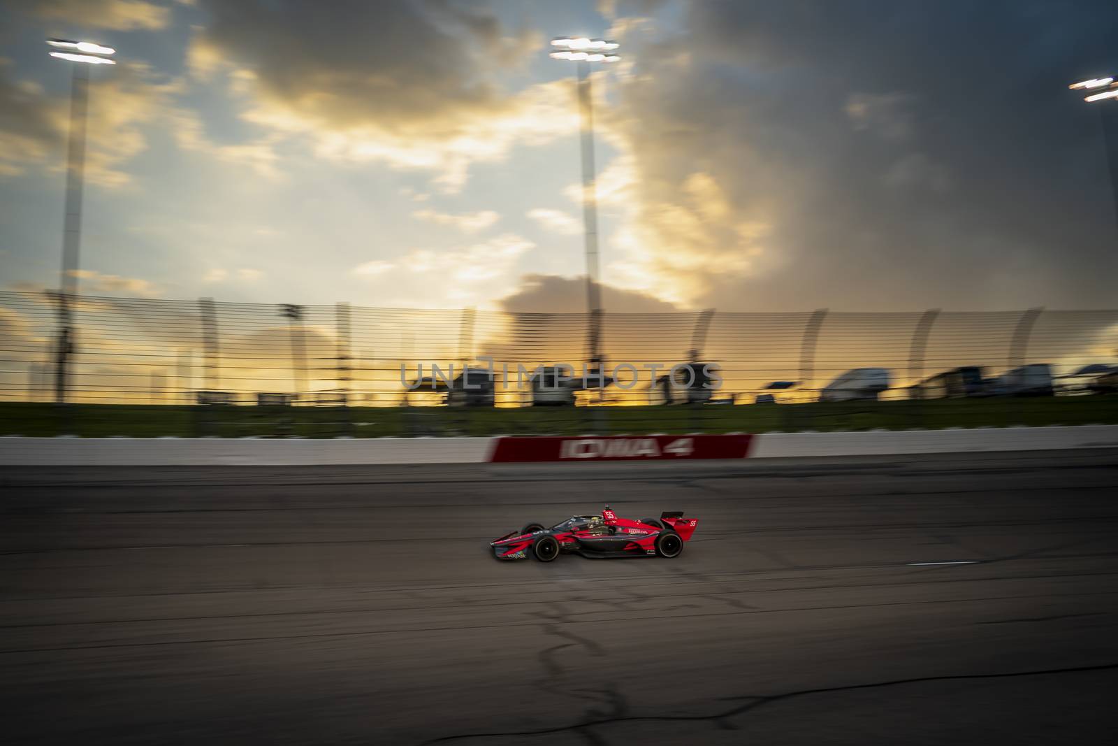ALEX PALOU (R) (55) of Barcelona, Spain races through the turns during the race for the Iowa INDYCAR 250s at Iowa Speedway in Newton, Iowa.