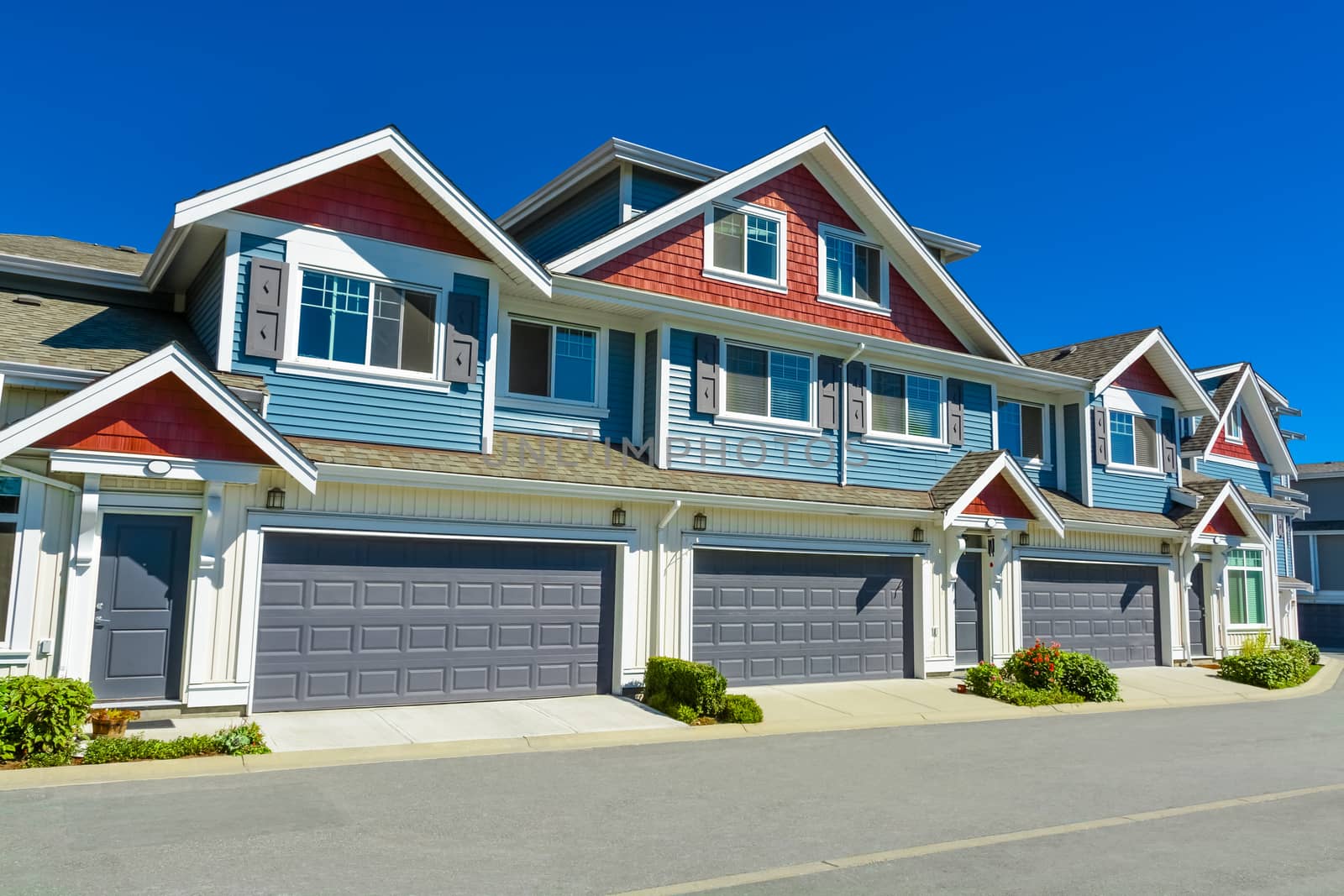 Nice and comfortable neighborhood. New homes, condos, and townhouses on a street in suburbs of Vancouver, Canada