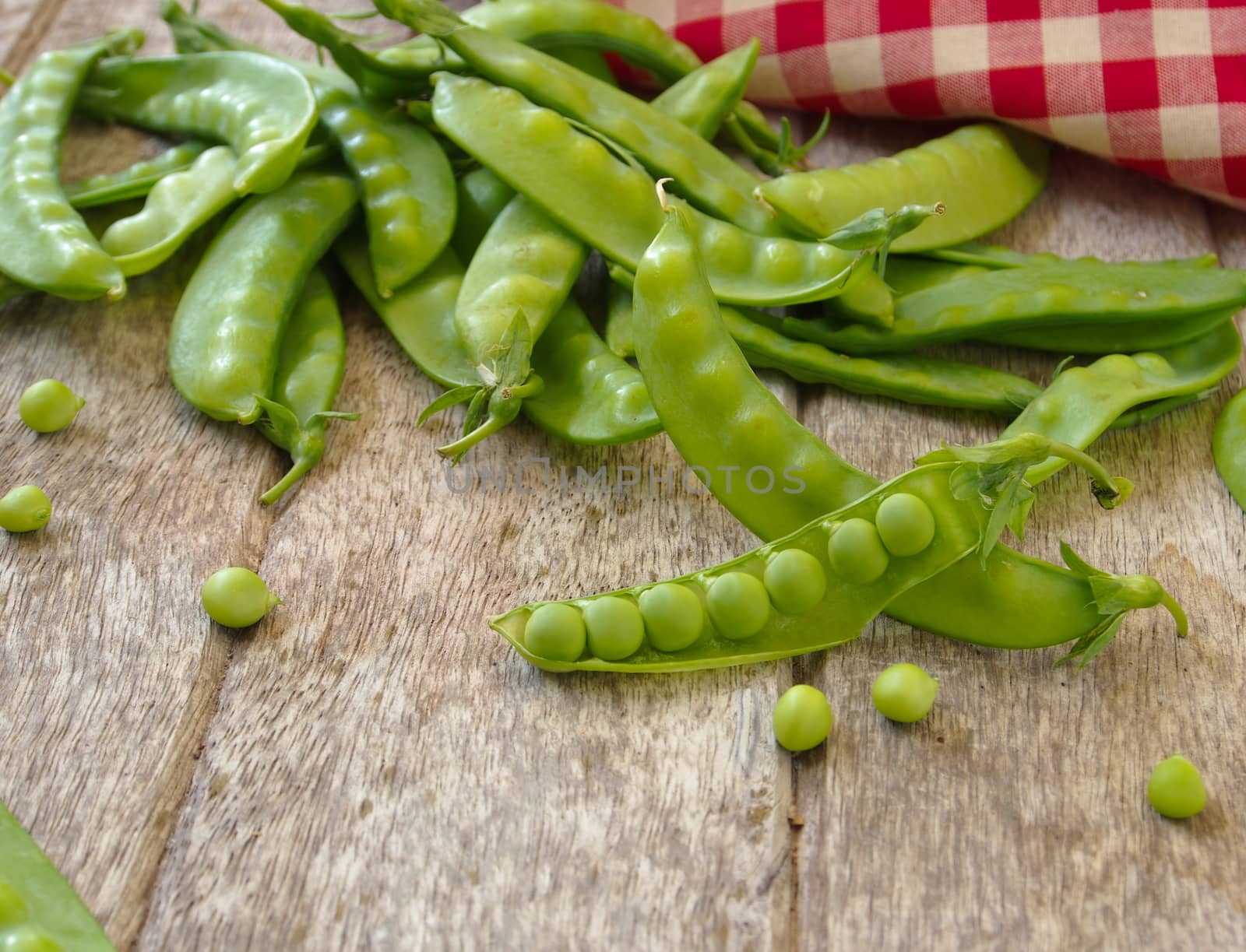 peas on wooden background