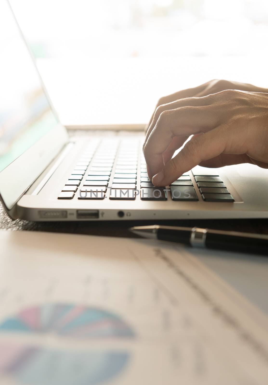 Businessmen's hands typing on laptop keybord