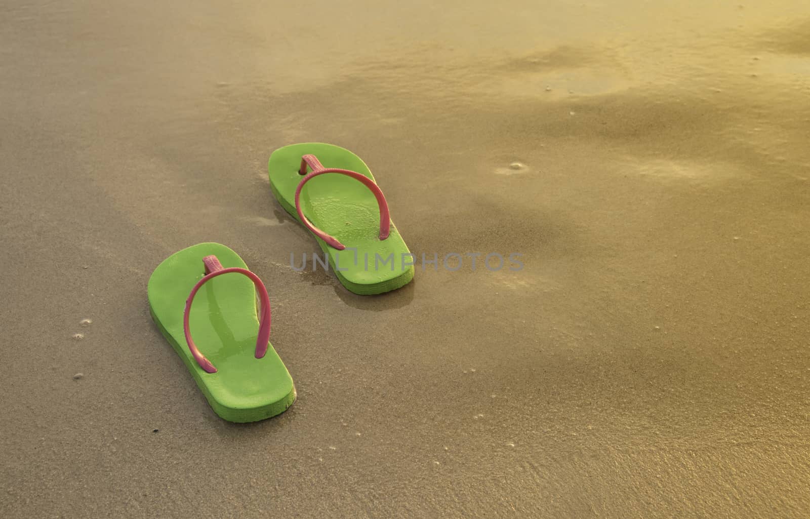 Summer vacation concept--Flipflops on a sandy ocean beach