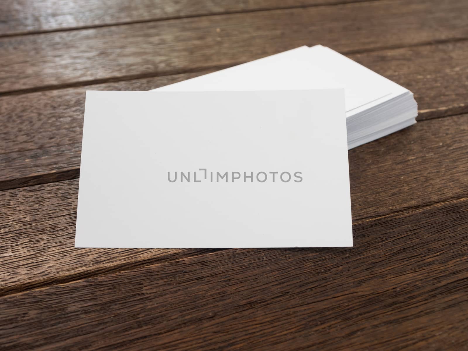 business card placed on a wooden table