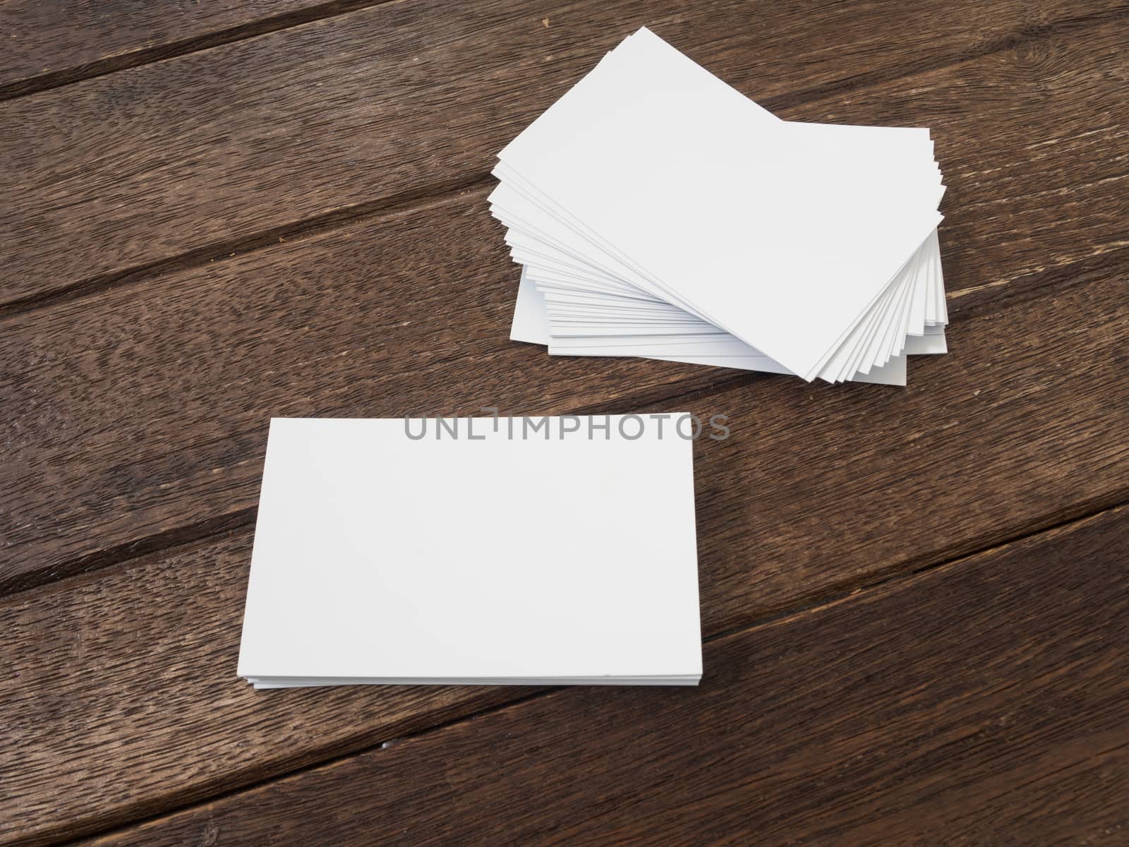 business card placed on a wooden table