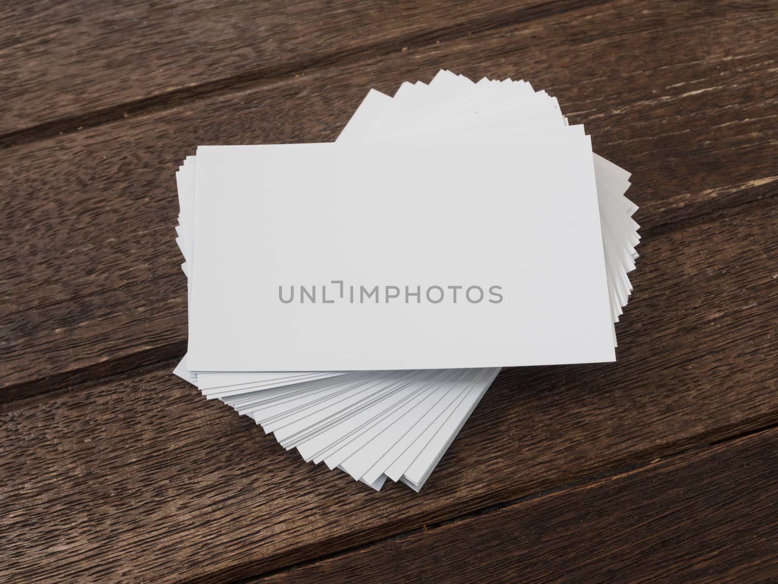 business card placed on a wooden table