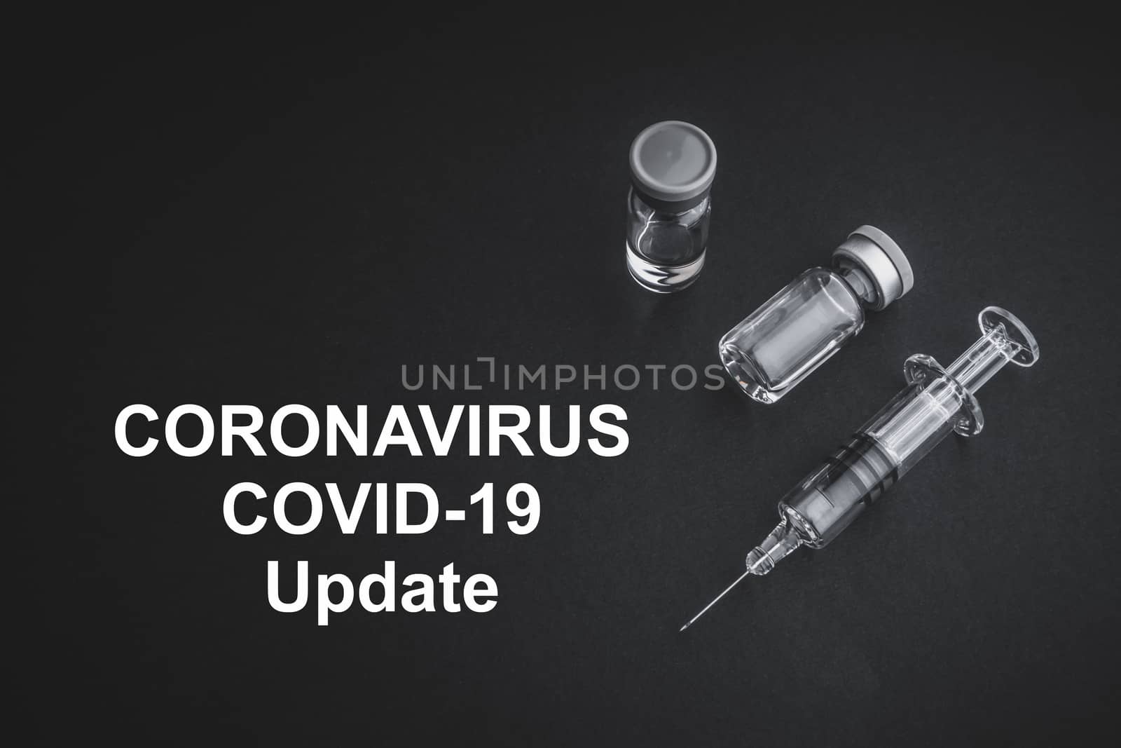 CORONAVIRUS COVID-19 UPDATE text with syringe and vials on black background by silverwings