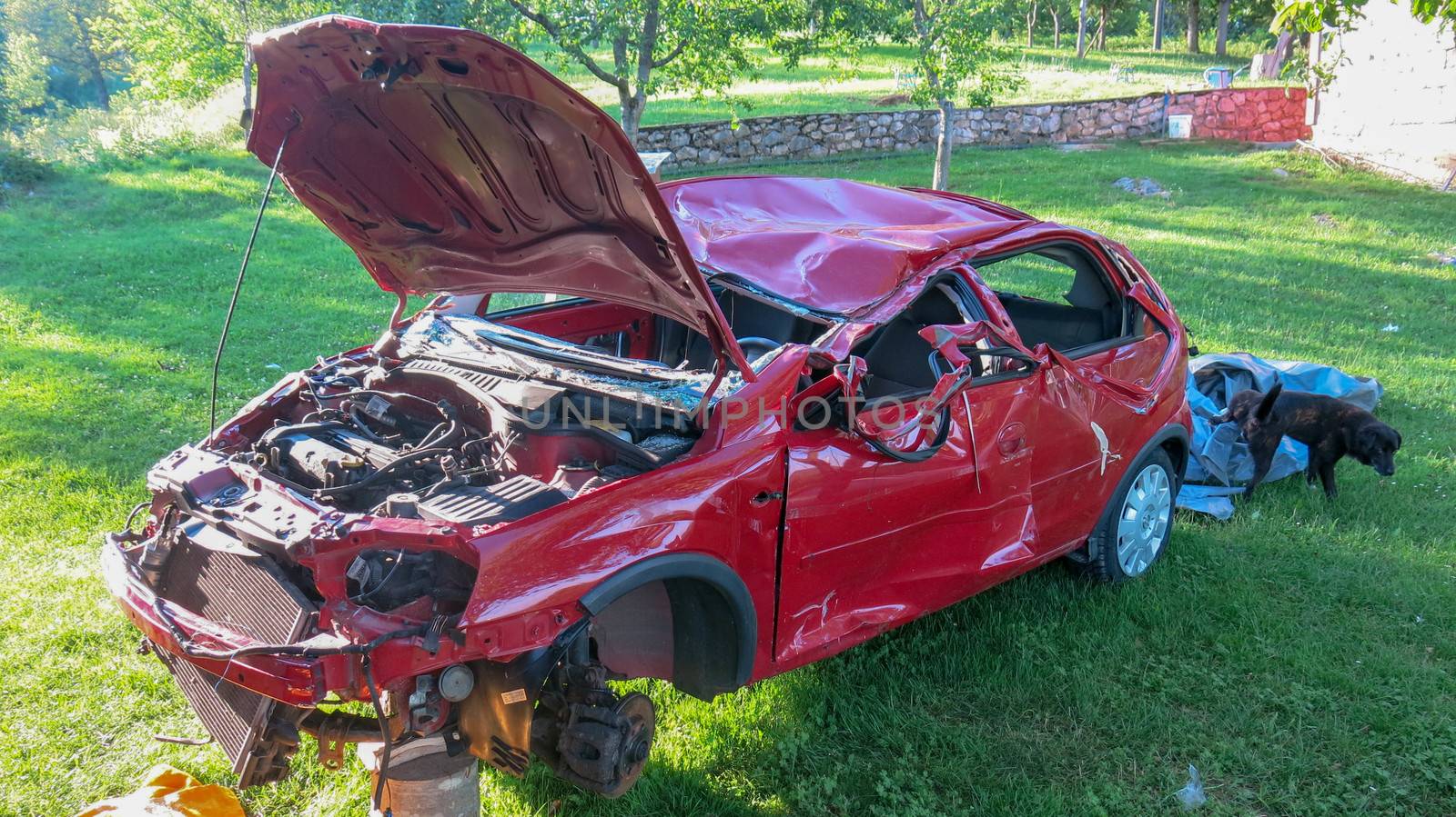 Red Car crash background.Red car accident shattered and crumpled.