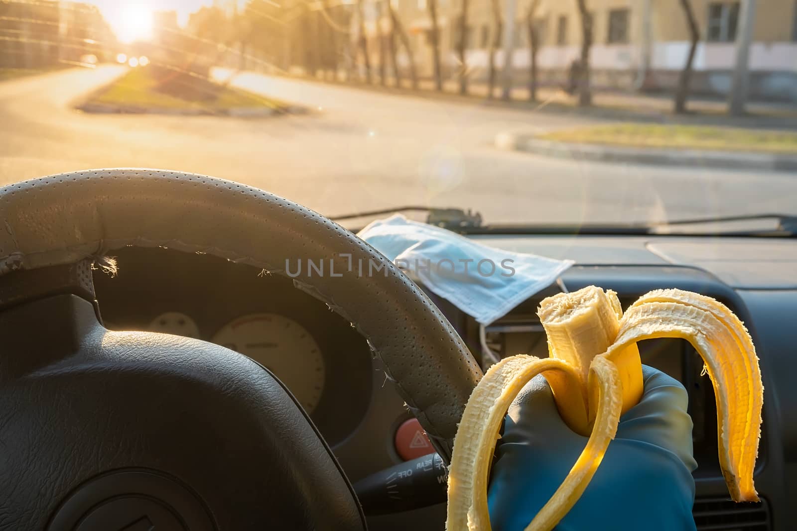 safe food, banana in the car driver hand by jk3030