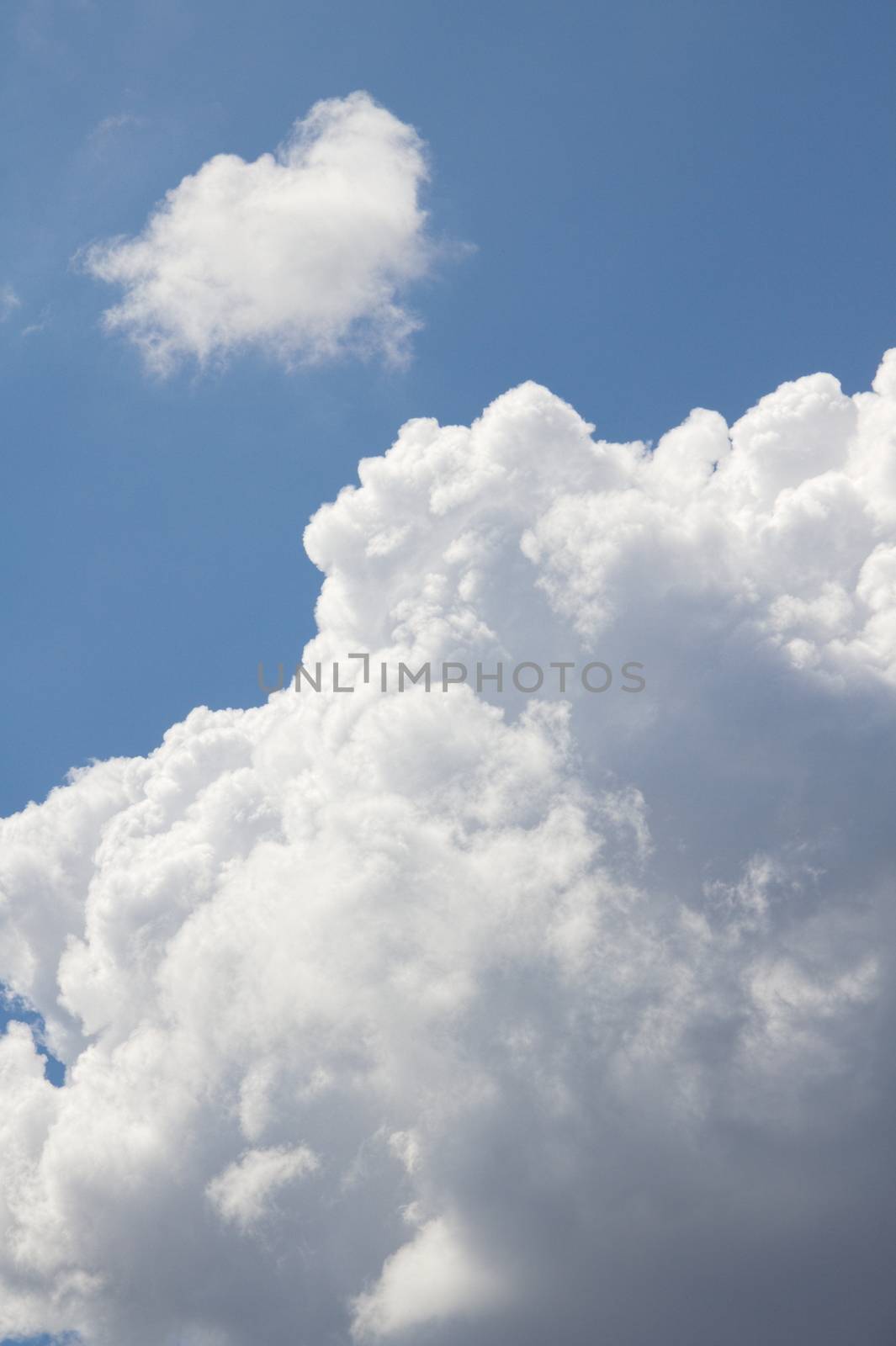 Blue sky background with clouds.